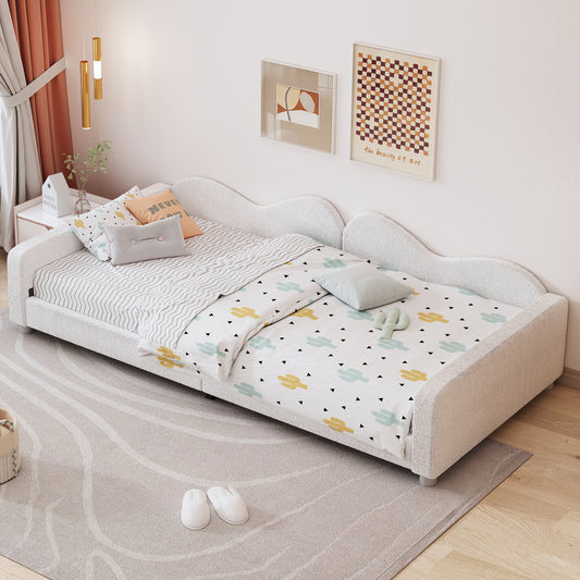 White boucle fabric twin bed with cactus print bedding and wave pattern rug