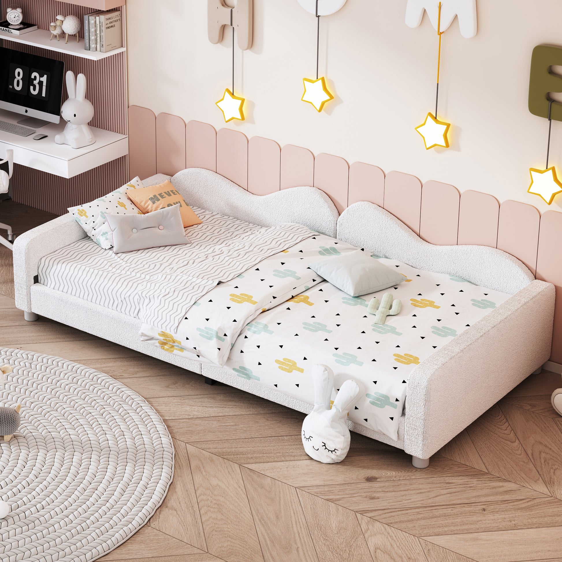 White upholstered twin bed with cactus print bedding for a childs room