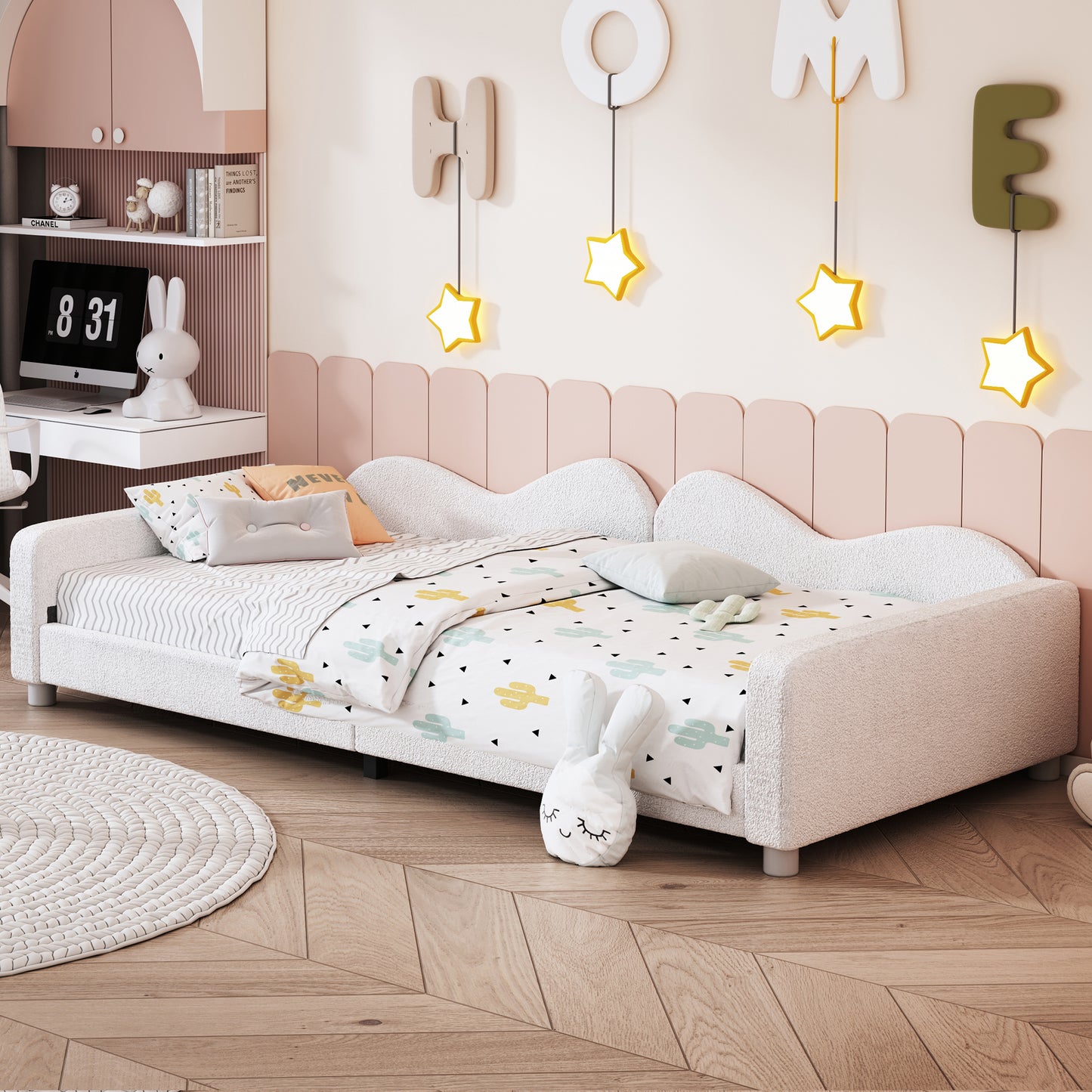 Plush white toddler bed with cactus print bedding and playful decor