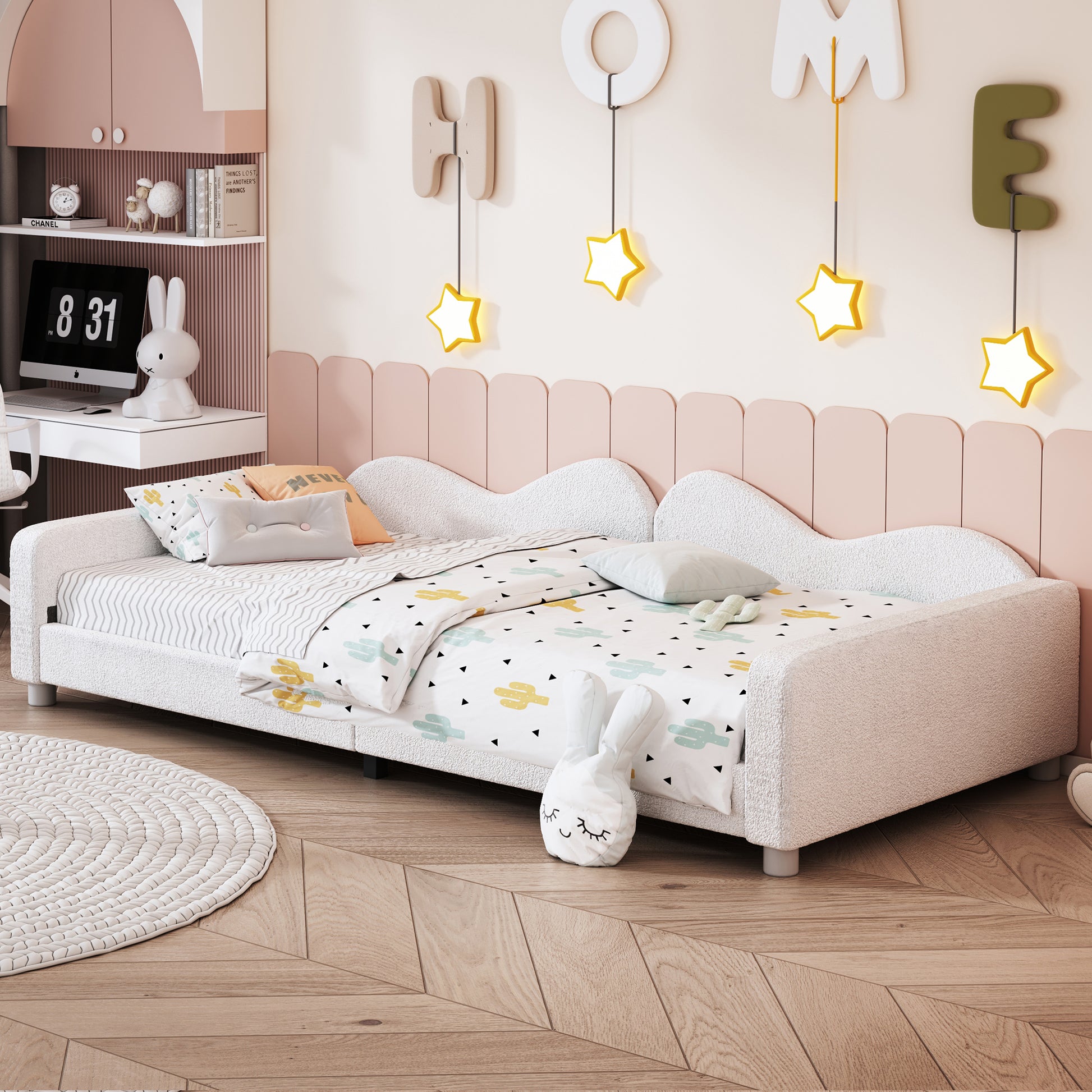 Plush white toddler bed with cactus print bedding and playful decor