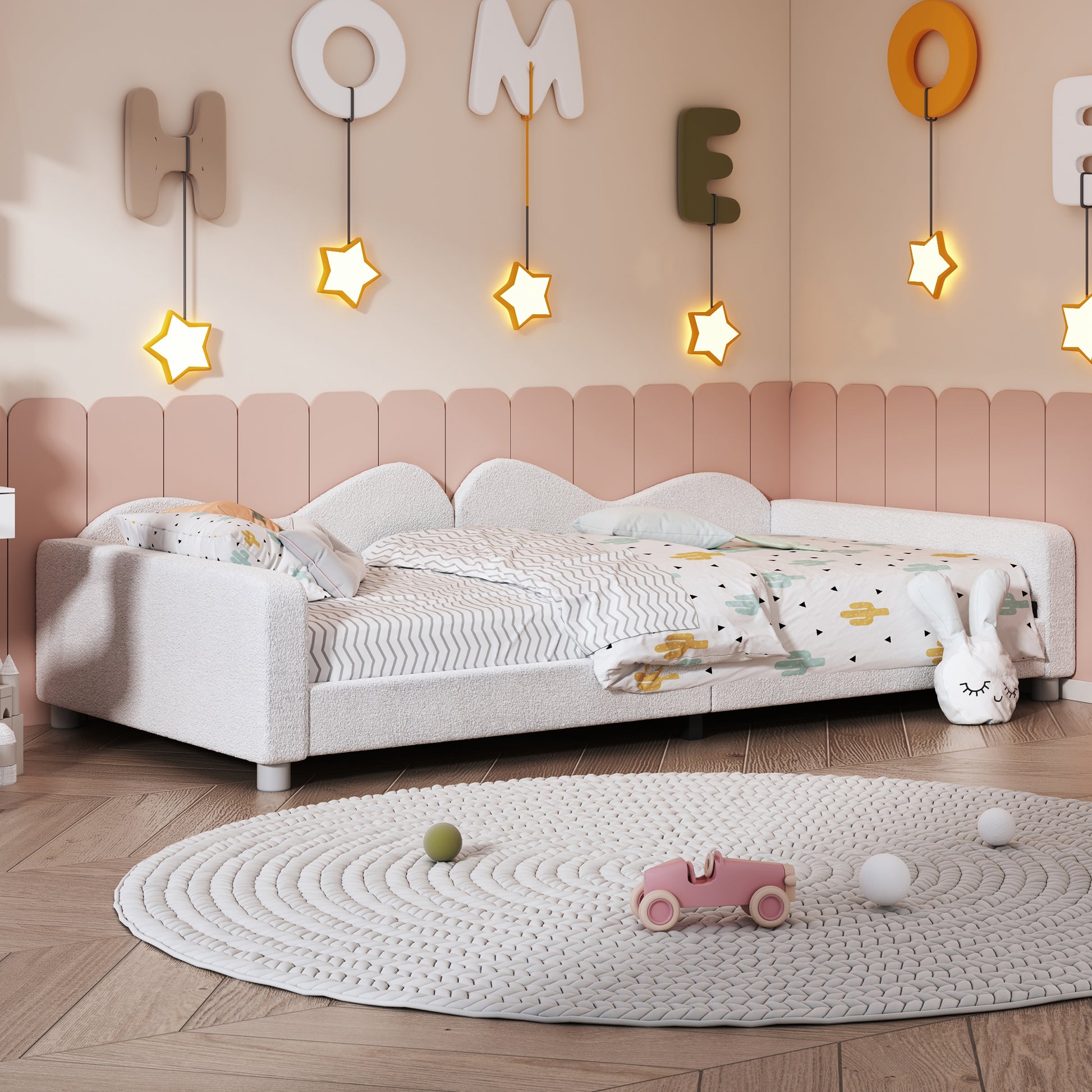 Cozy white boucle toddler bed with playful cactus print bedding