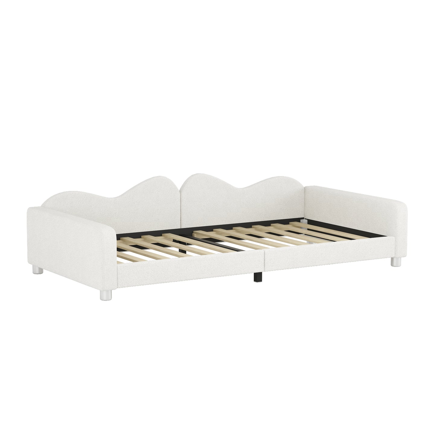 White upholstered daybed with a wavy headboard and slatted base