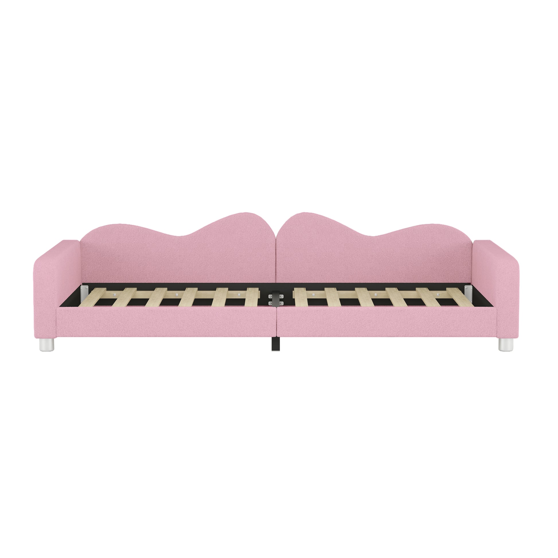 Pink upholstered twin daybed with waveshaped backrests and slatted base