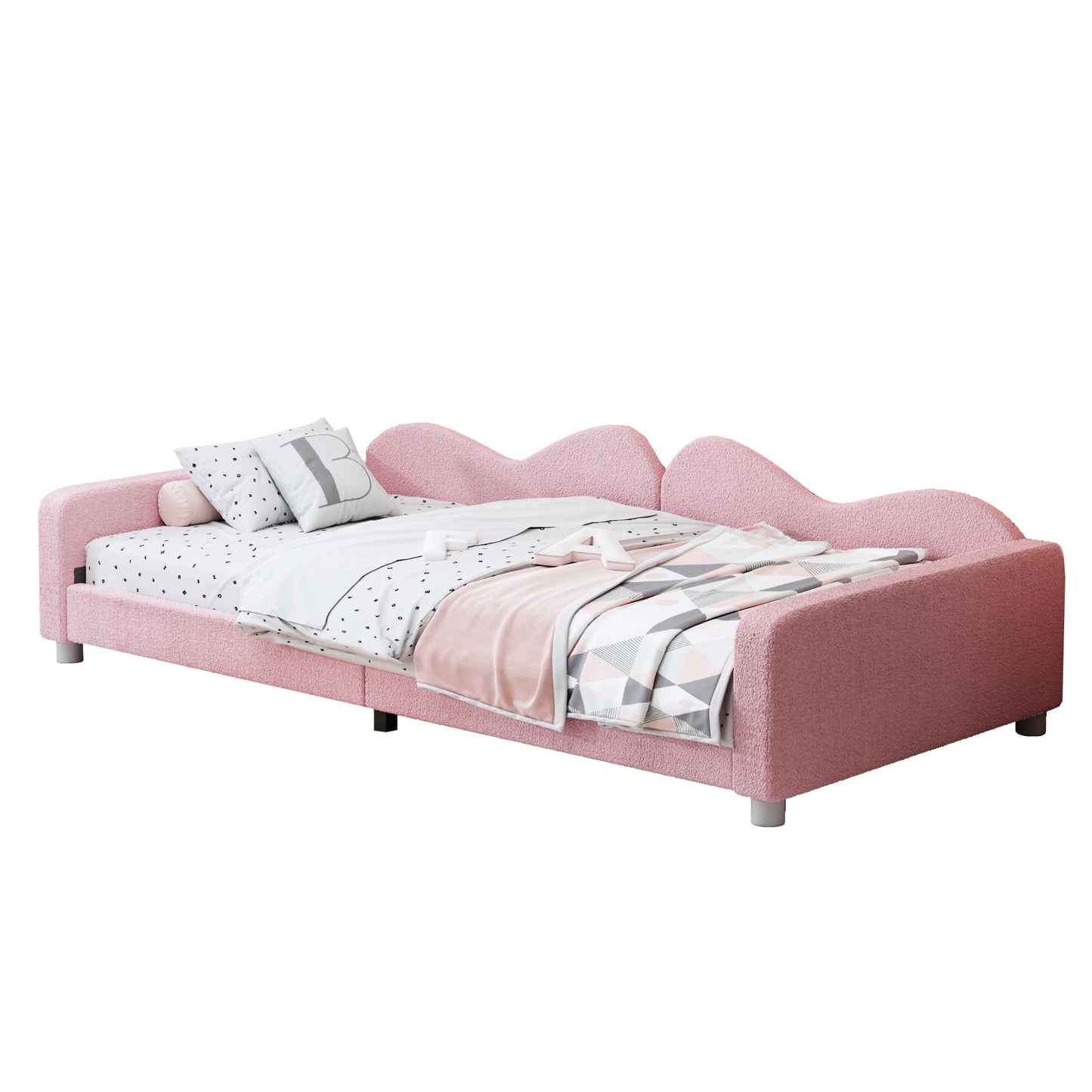 Pink boucle toddler bed with playful wavy headboard and patterned bedding