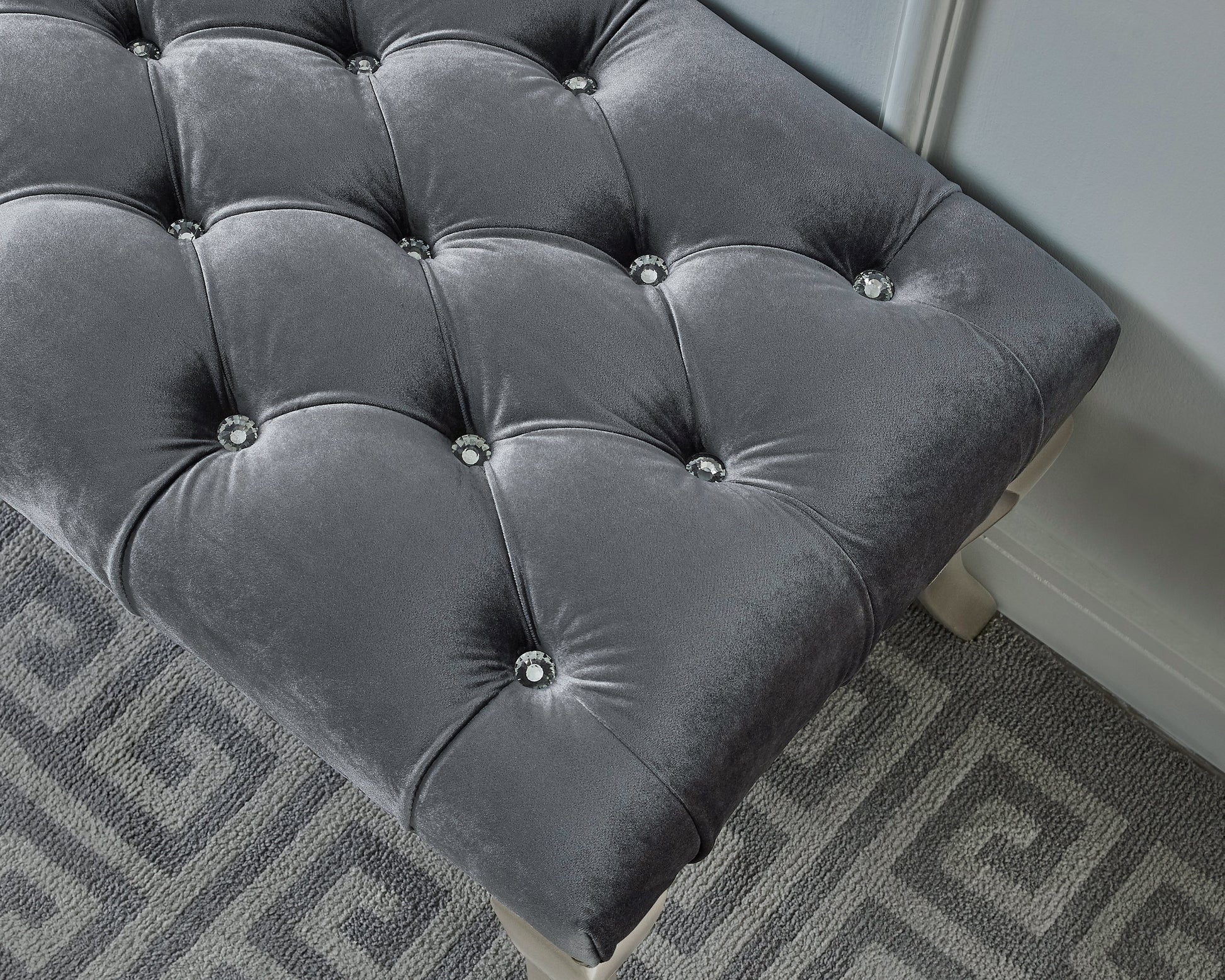 Tufted grey velvet ottoman with crystal accents