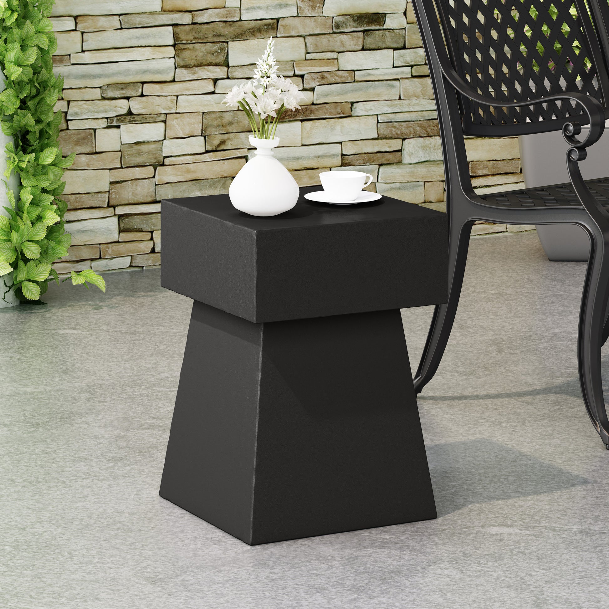 Modern black geometric accent table with clean lines perfect for patio use