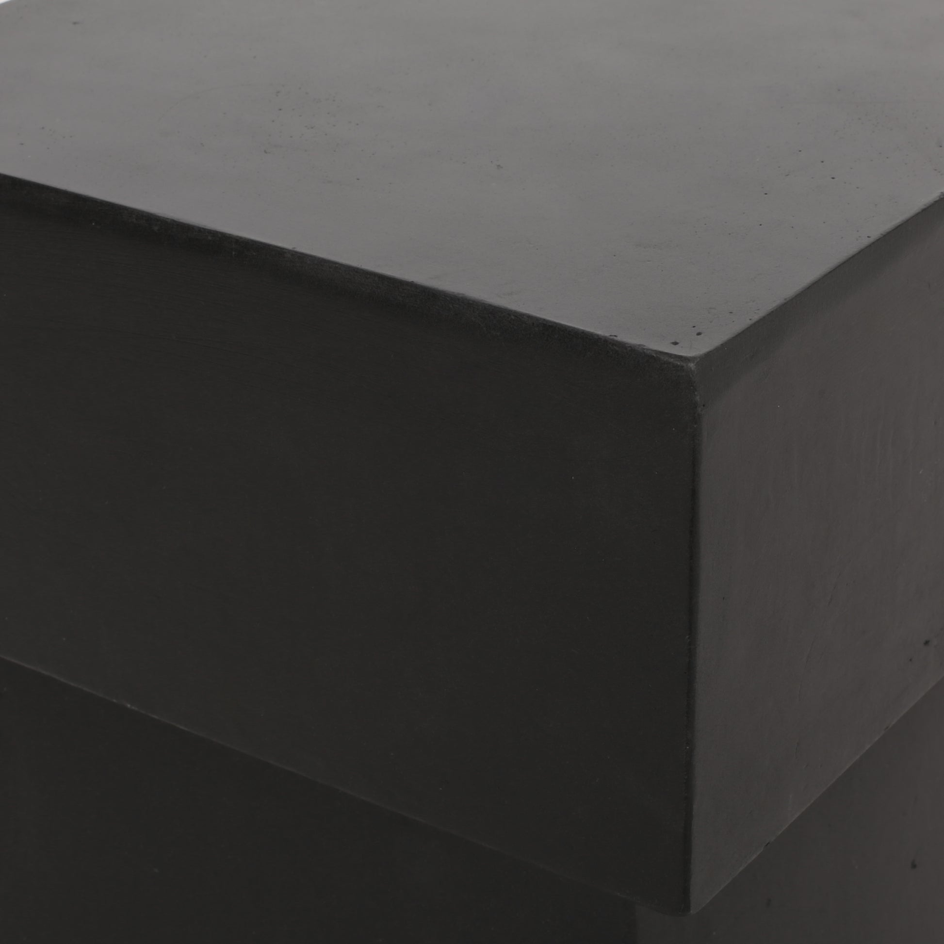 Matte black concrete cube stool with clean lines perfect for modern decor