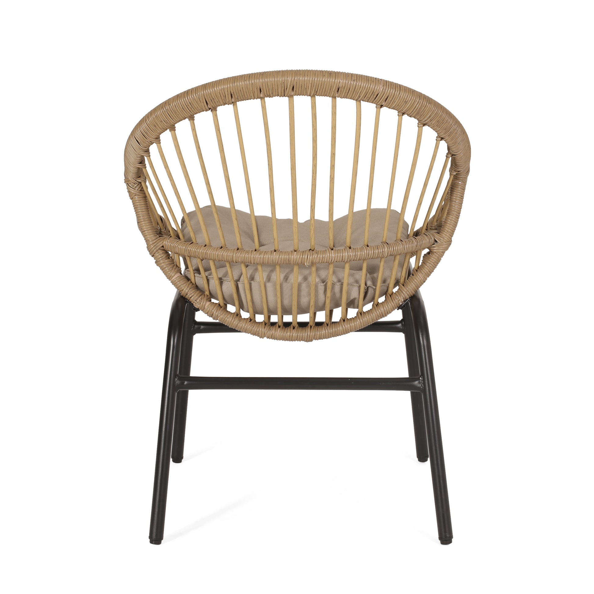 Round wicker accent chair with tan cushion and black metal legs