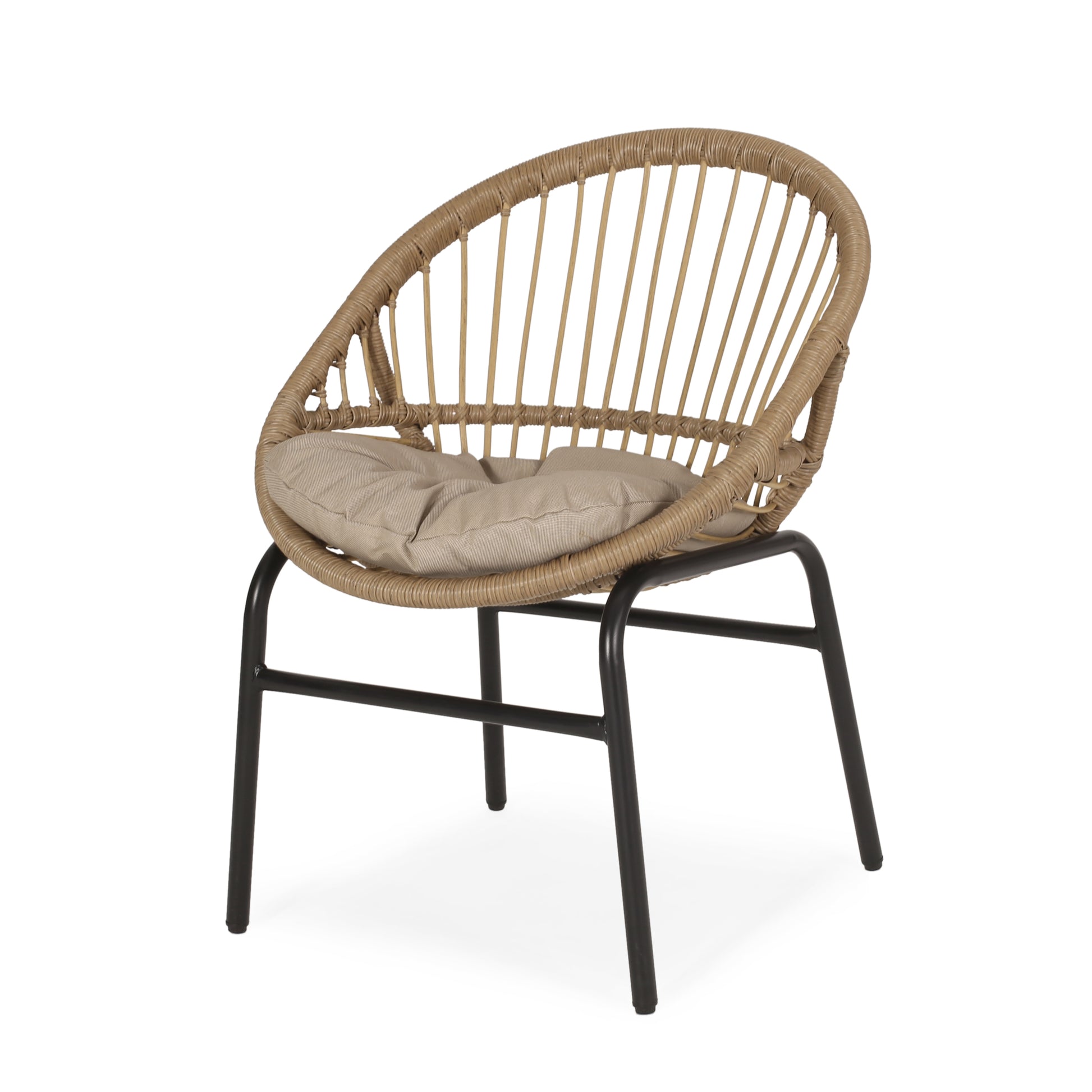 Round rattan chair with natural weave and beige cushion on black metal legs
