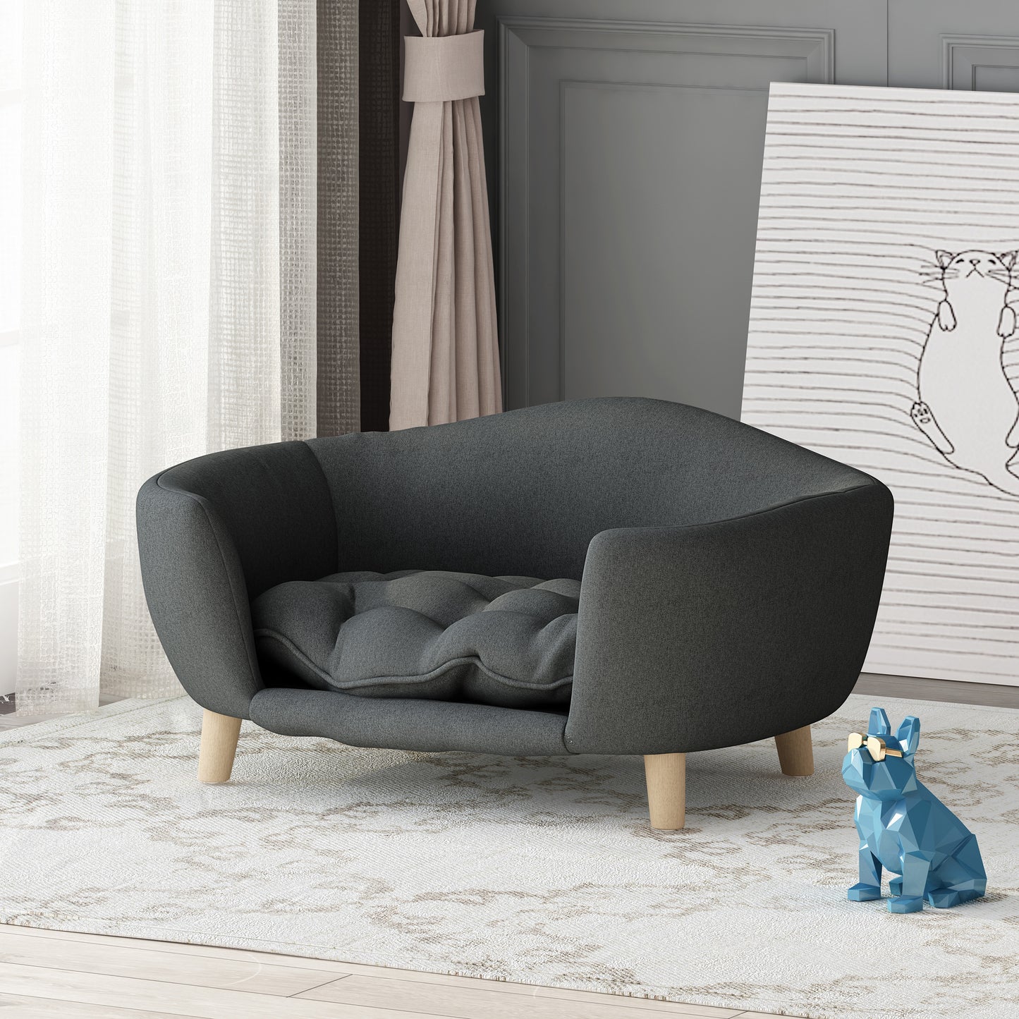 Dark gray fabric dog bed with tufted cushion and wooden legs