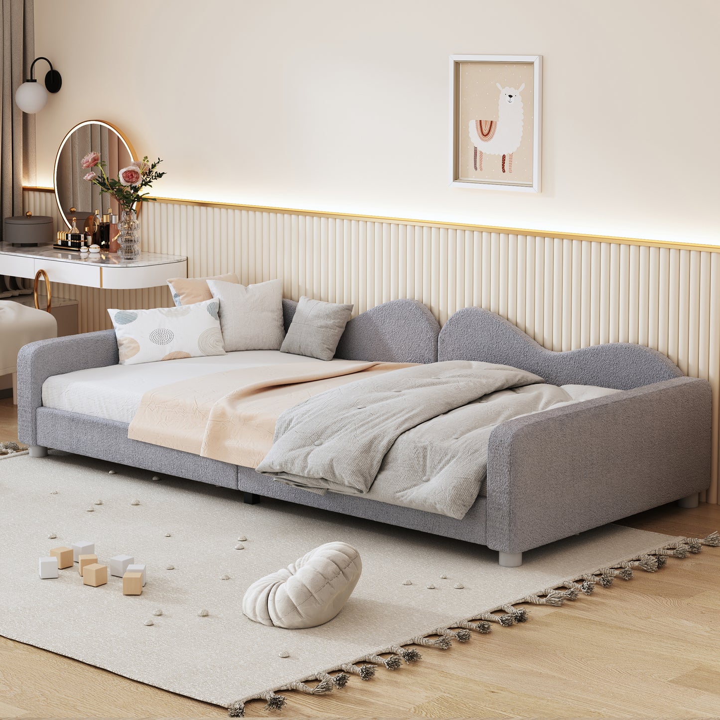 Gray upholstered daybed with plush cushions and tufted back