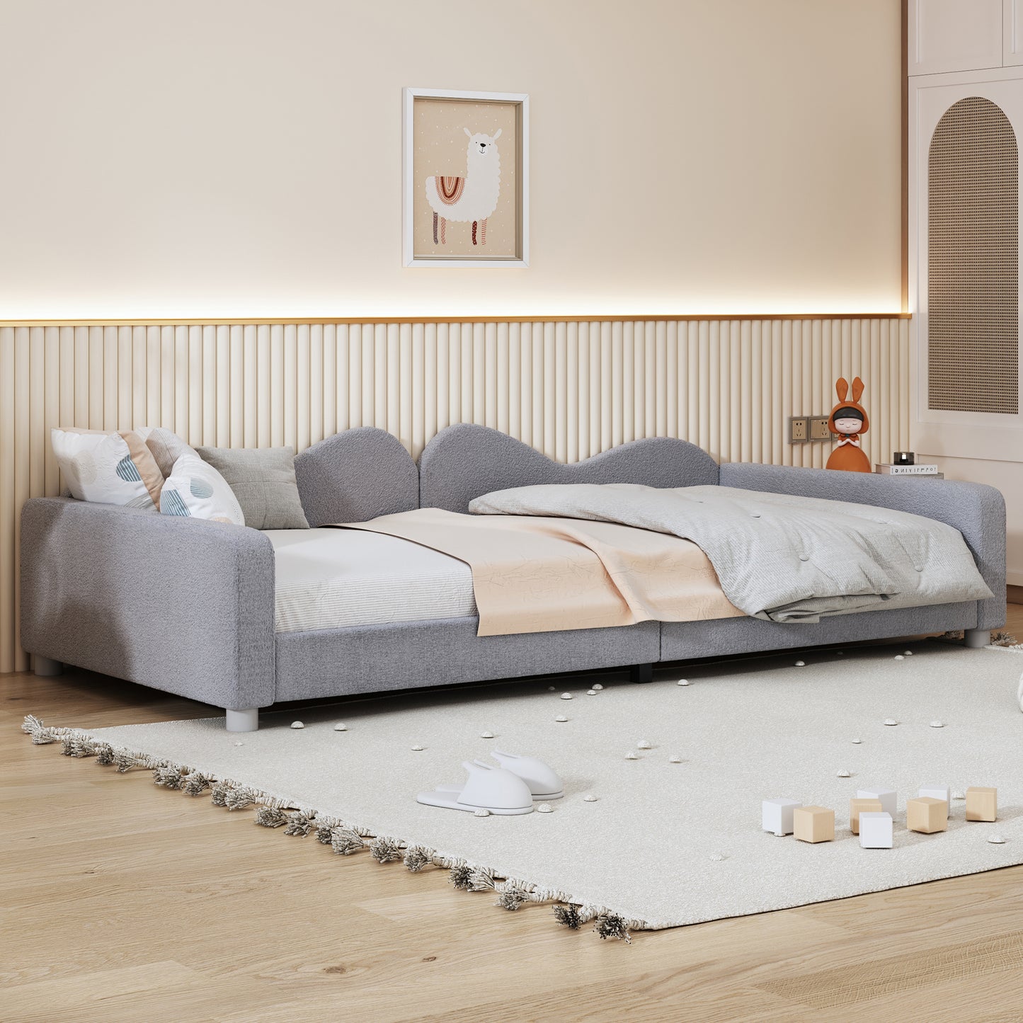 Gray upholstered daybed with playful scalloped edges perfect for a childs room