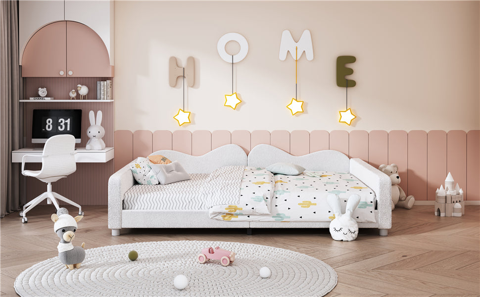 White upholstered toddler bed with cactus print bedding and playful star lights
