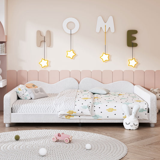 Fluffy white twin bed with cactus print bedding and a pink headboard