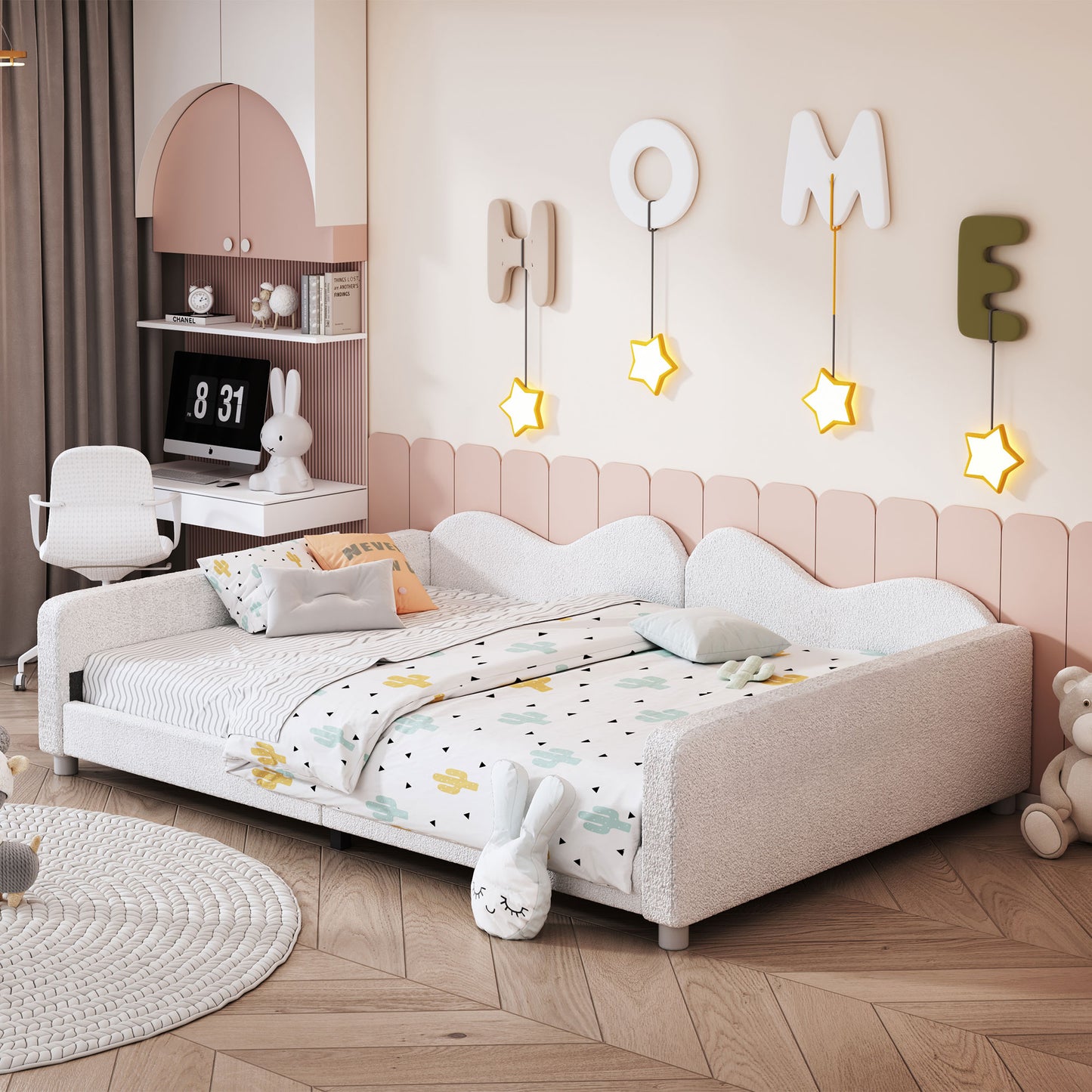 White upholstered daybed with cactus print bedding and pastel accents