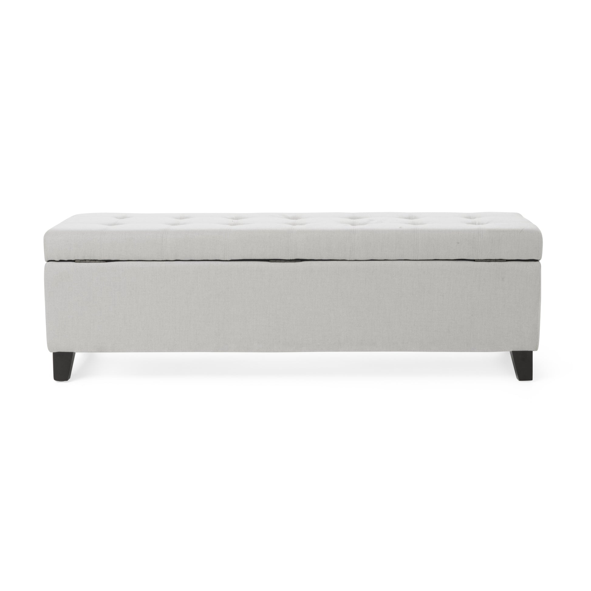 Light gray tufted storage ottoman with dark wooden legs