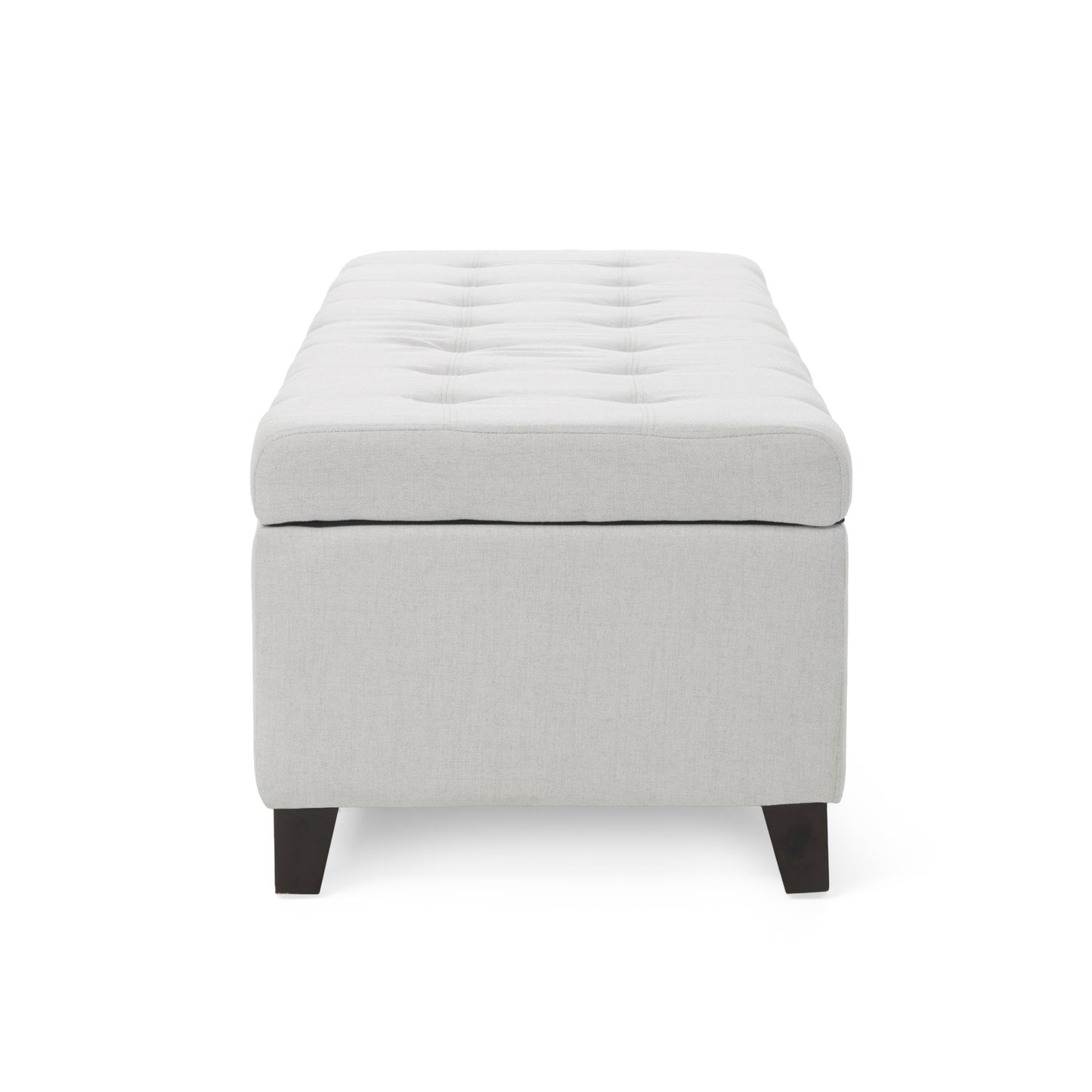 Tufted linen storage ottoman in light gray with dark wooden legs