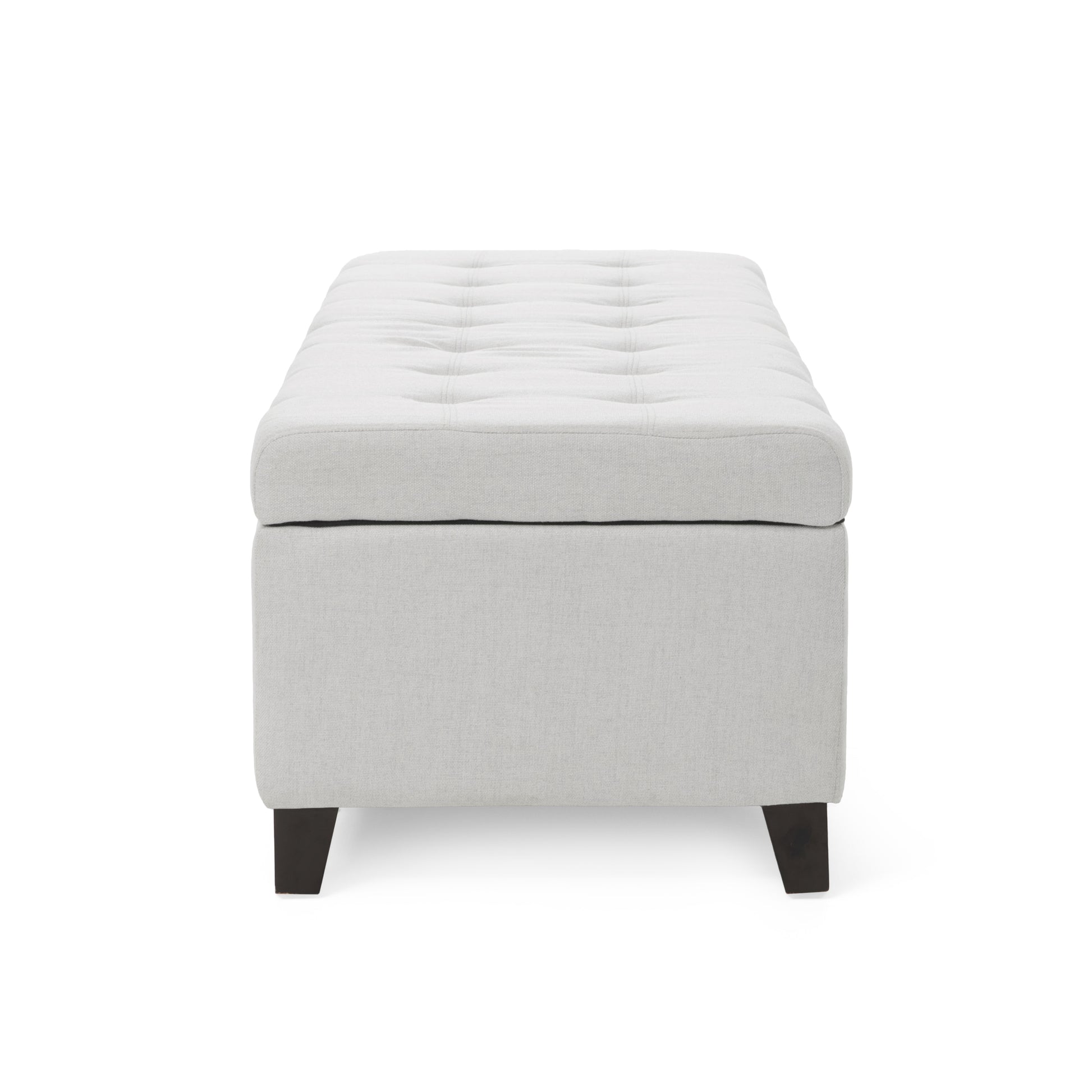Tufted linen storage ottoman in light gray with dark wooden legs