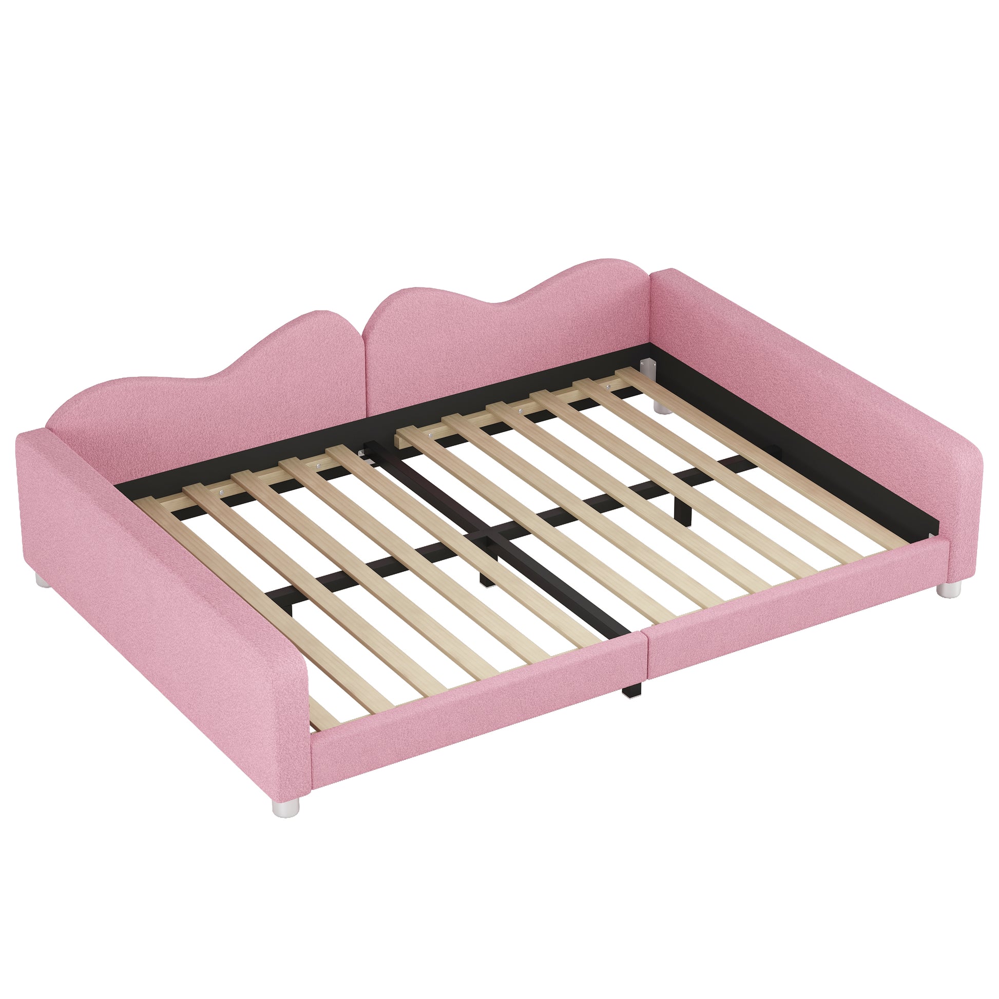 Pink upholstered toddler bed frame with wavy headboard and wooden slats