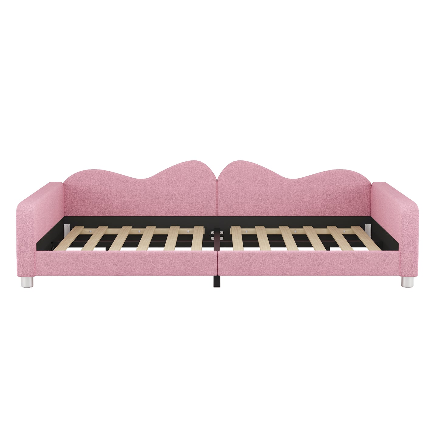 Pink upholstered daybed with a scalloped headboard perfect for kids rooms