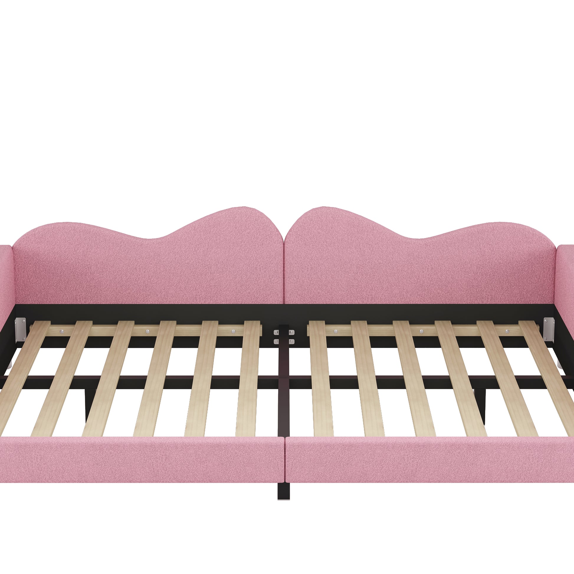 Closeup of a pink upholstered bed frame with wooden slats