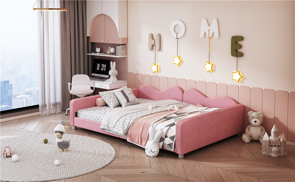 Pink upholstered twin daybed with wavy headboard and footboard