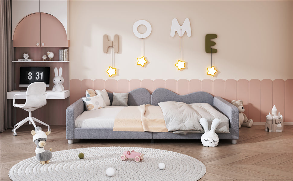 Gray upholstered daybed with soft bedding