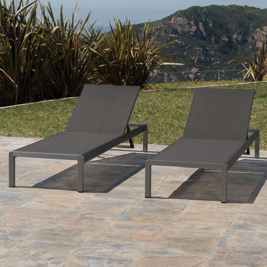 Modern grey aluminum outdoor lounge chair with dark grey fabric sling