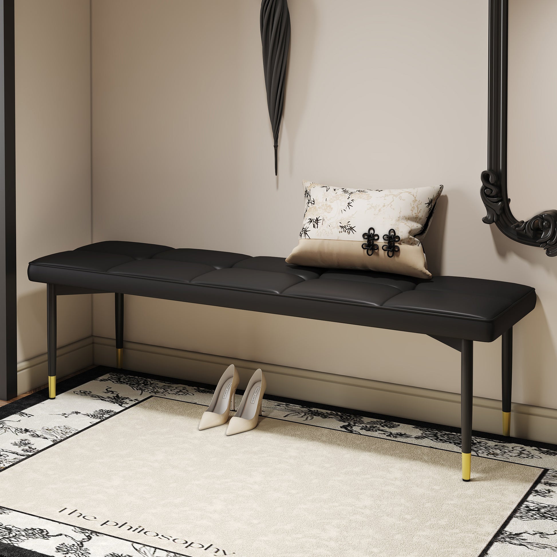 Tufted black faux leather entryway bench with goldtipped legs