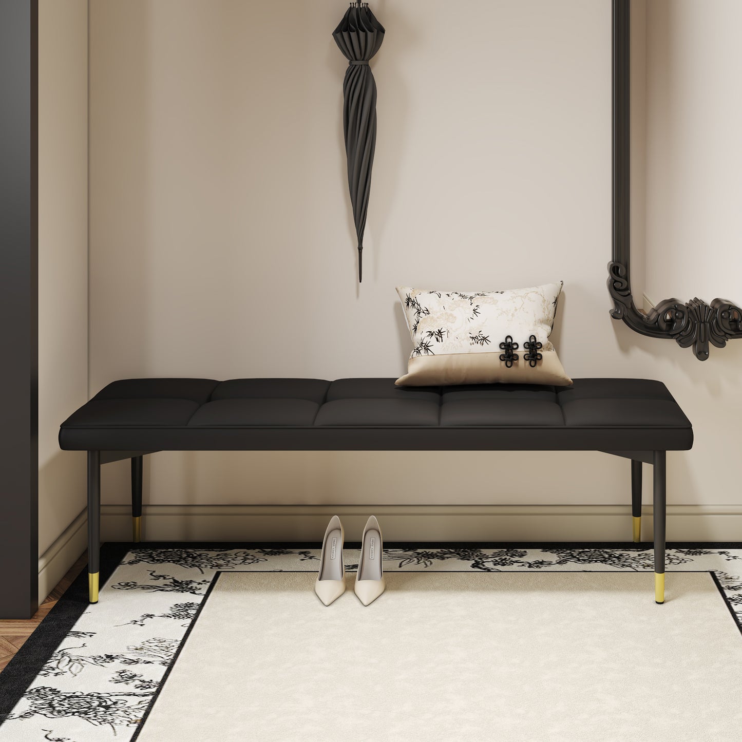 Black tufted velvet bench with goldtipped legs