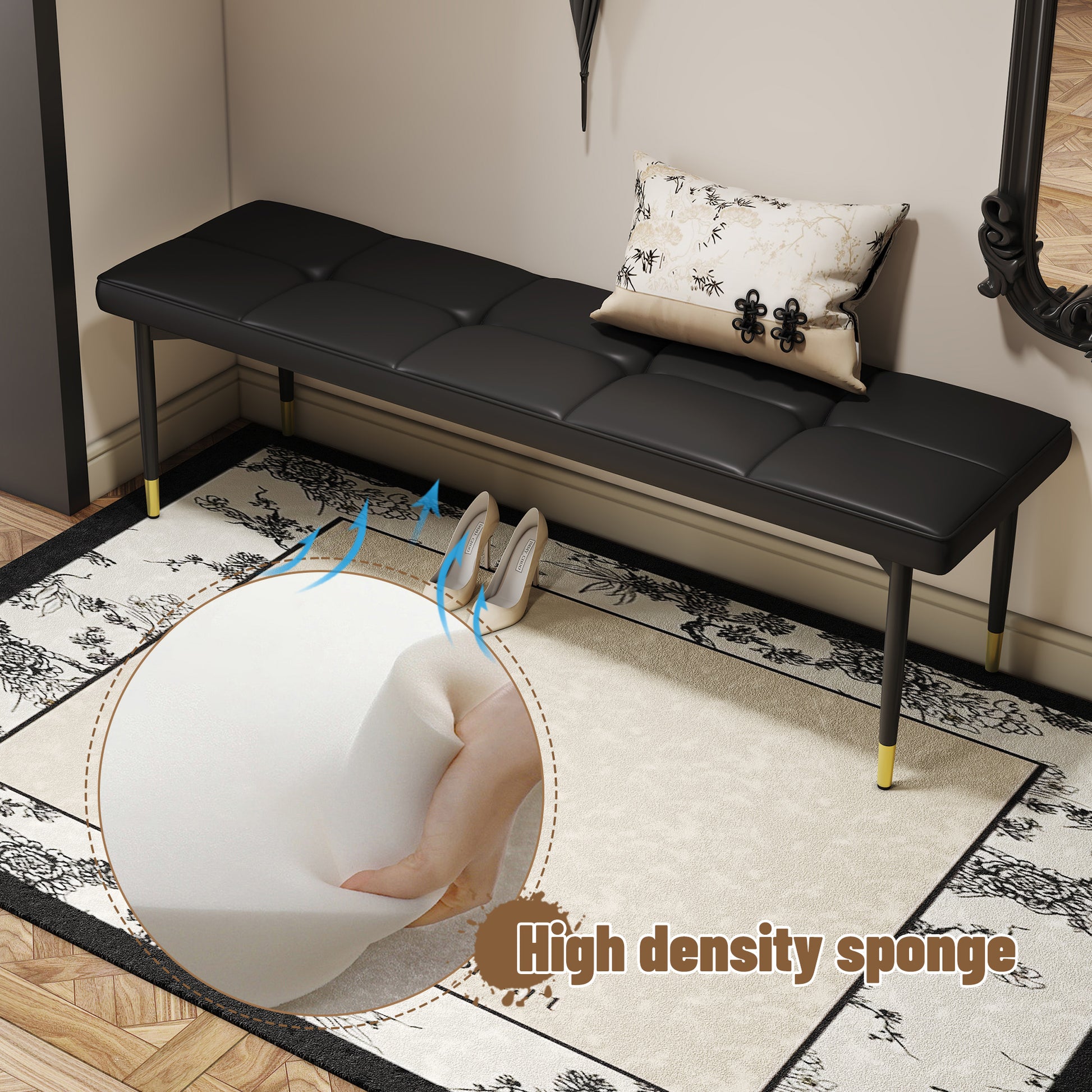 Black tufted leather entryway bench with goldtipped metal legs