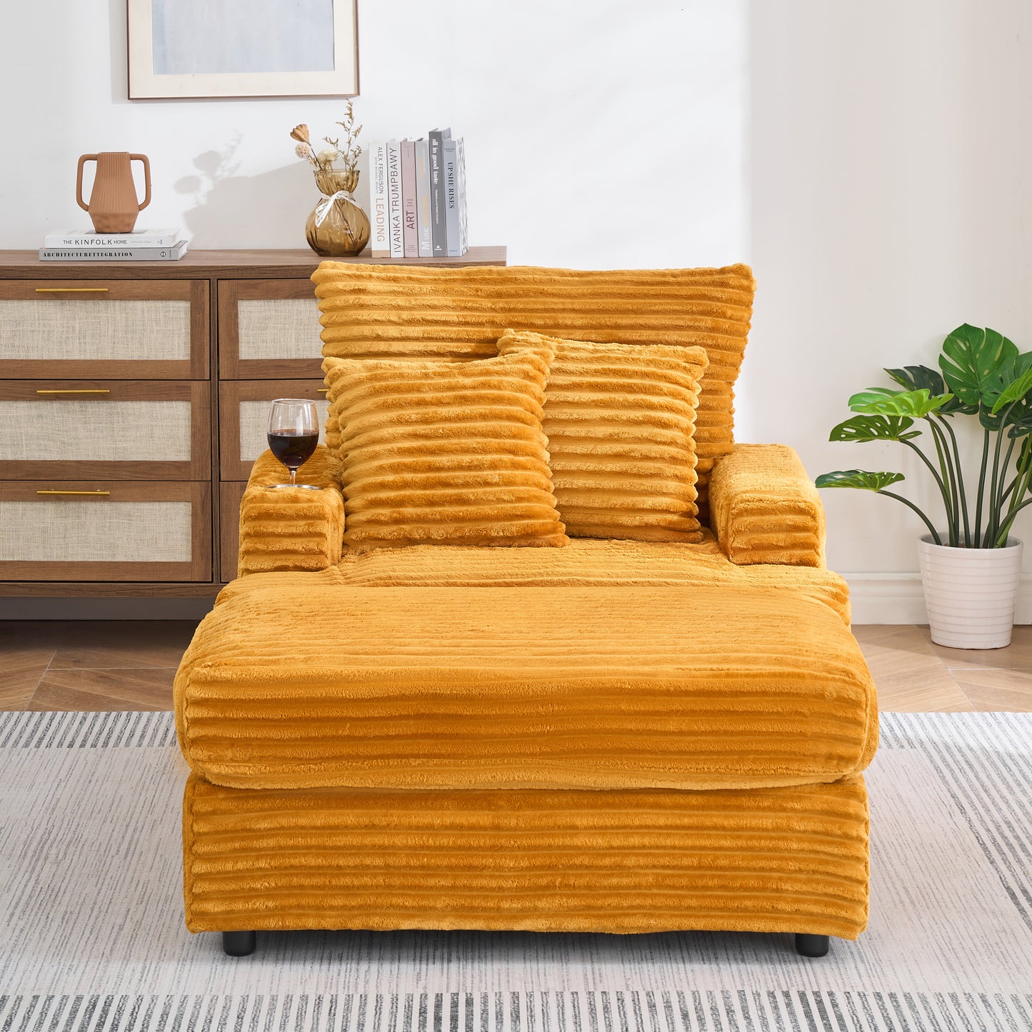 Plush mustard yellow corduroy accent chair with textured fabric and matching pillows