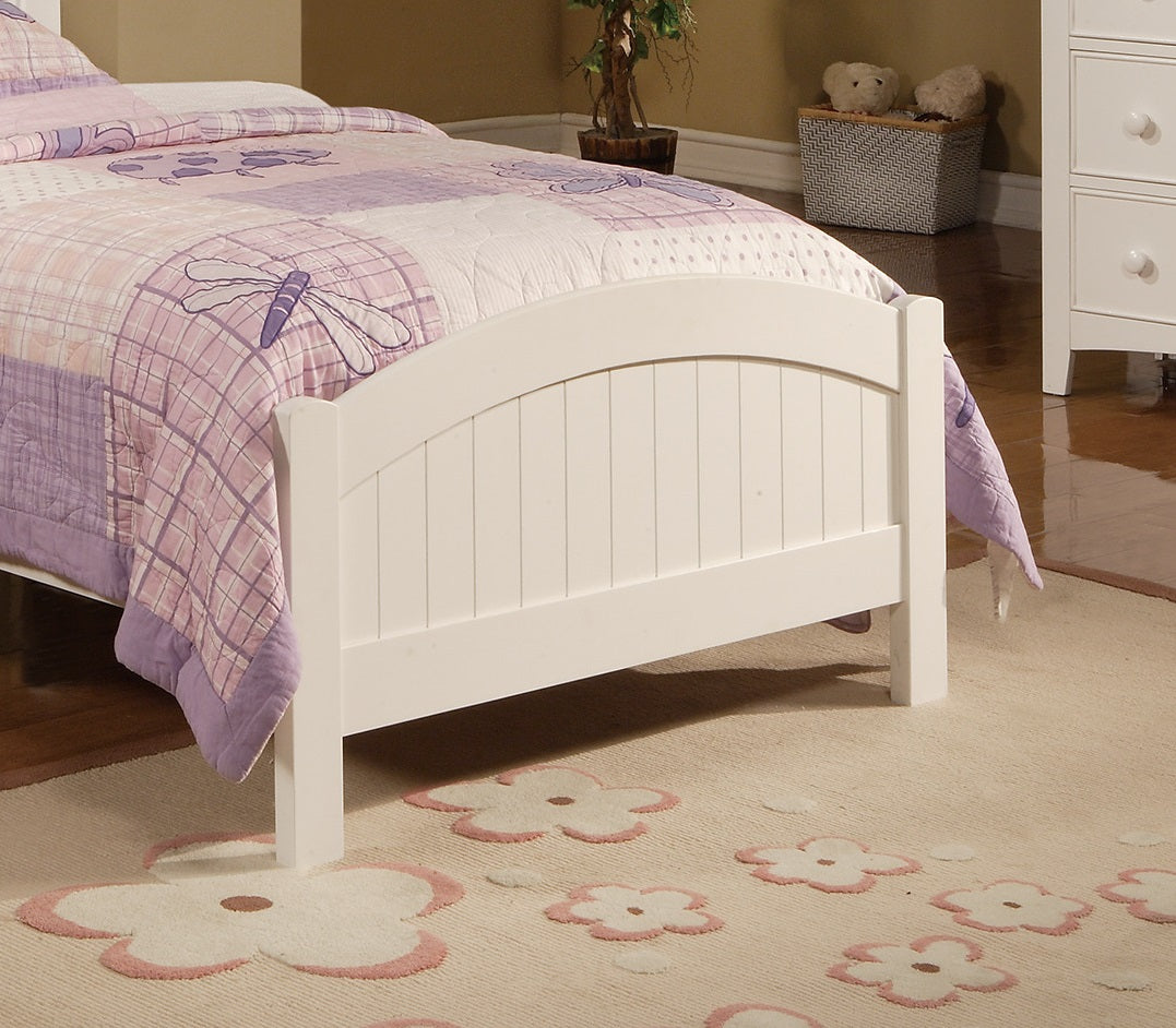 White wooden toddler bed with purple dragonfly quilt