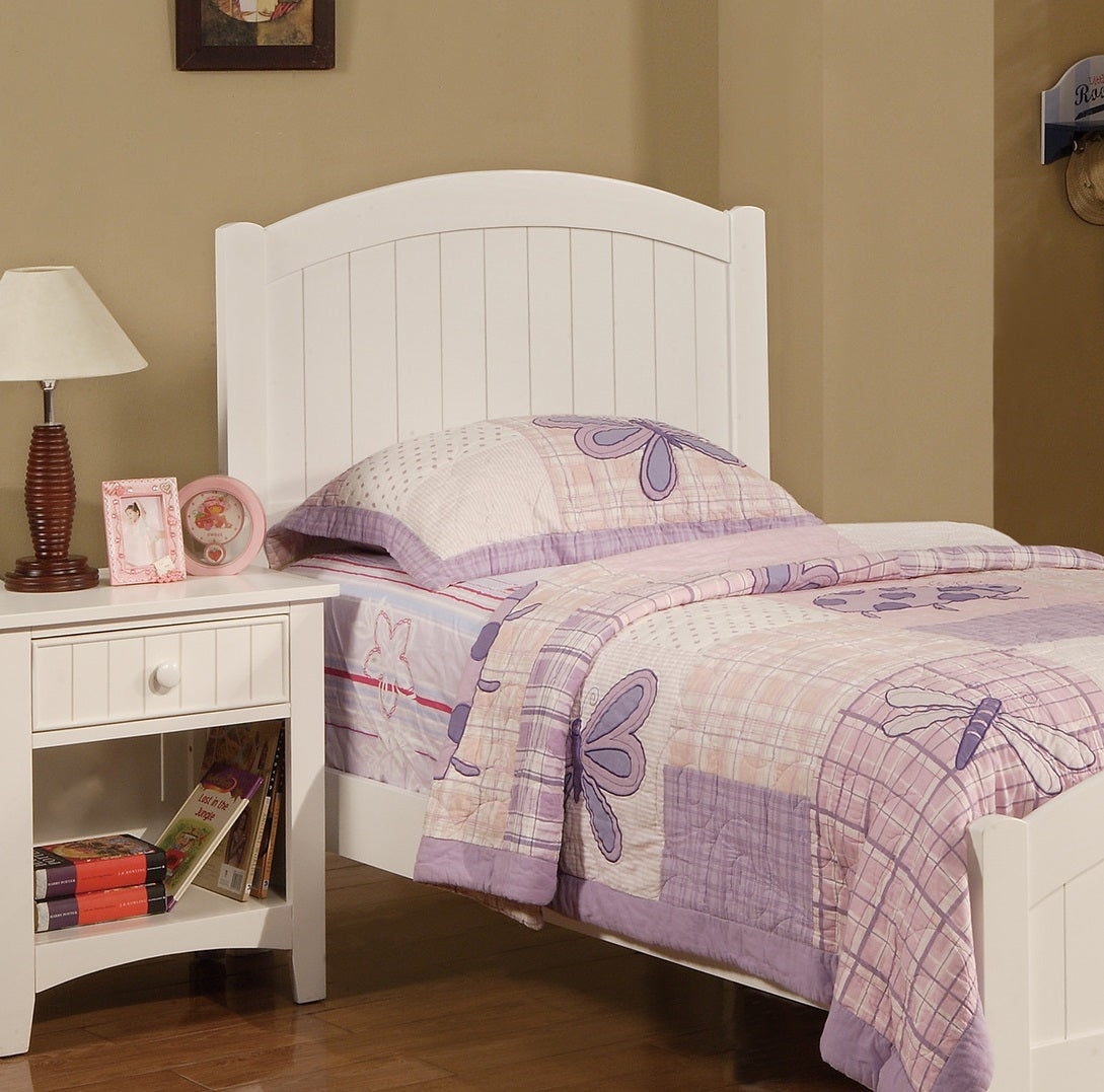 White twin bed with purple dragonfly comforter and headboard