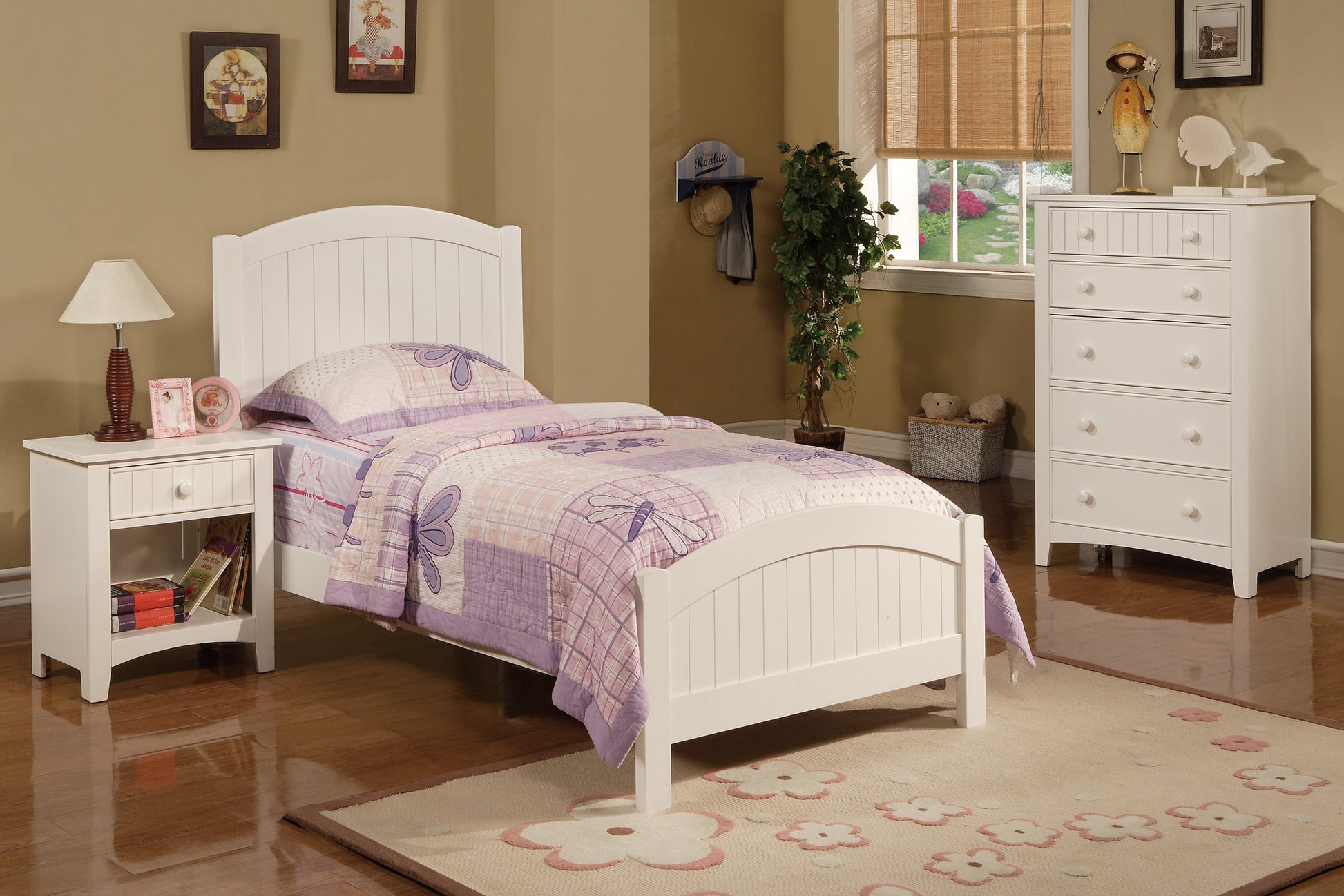 White wooden kids bed with purple dragonfly bedding and floral rug