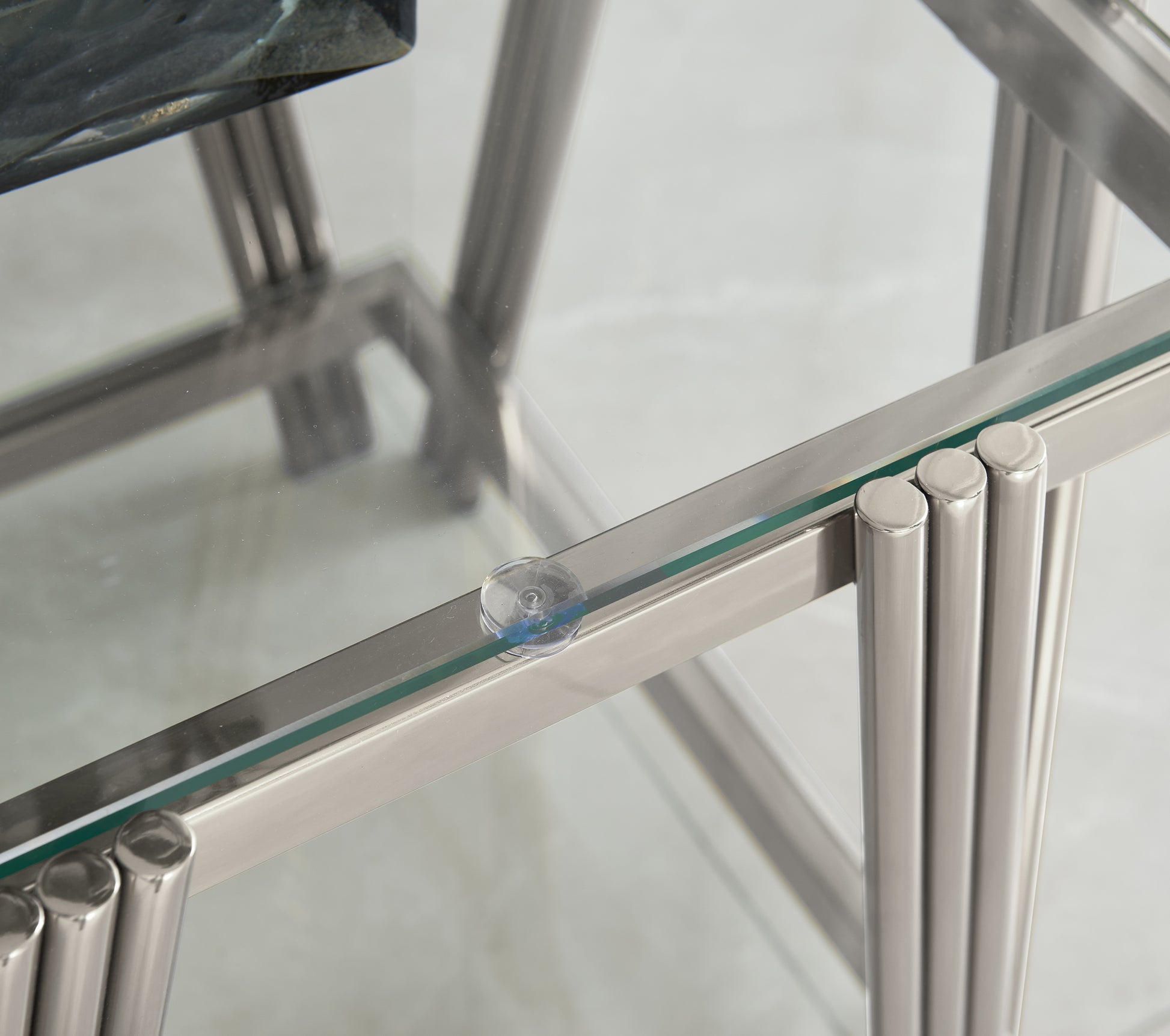 Glass and chrome side table with a clear tempered glass top and polished chrome legs
