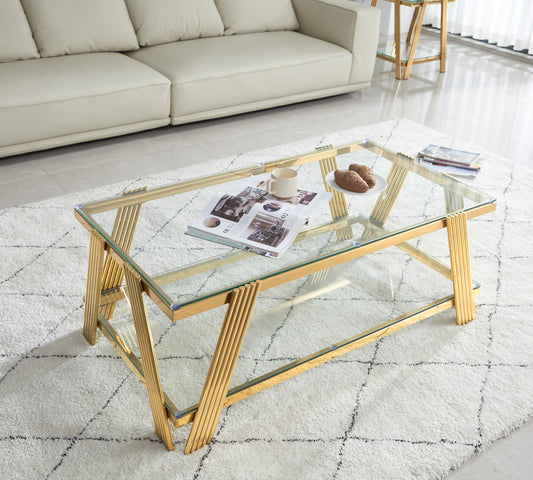 Glass coffee table with gold ribbed legs