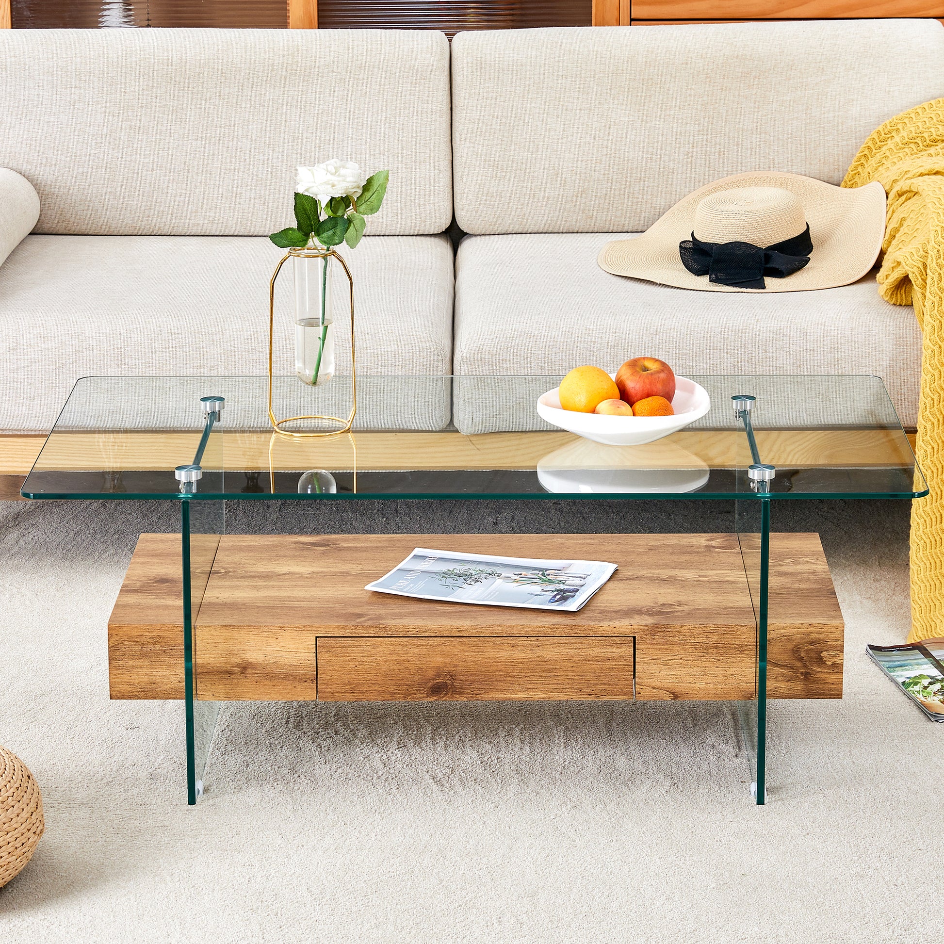 Modern coffee table with clear glass top and oak wood drawer