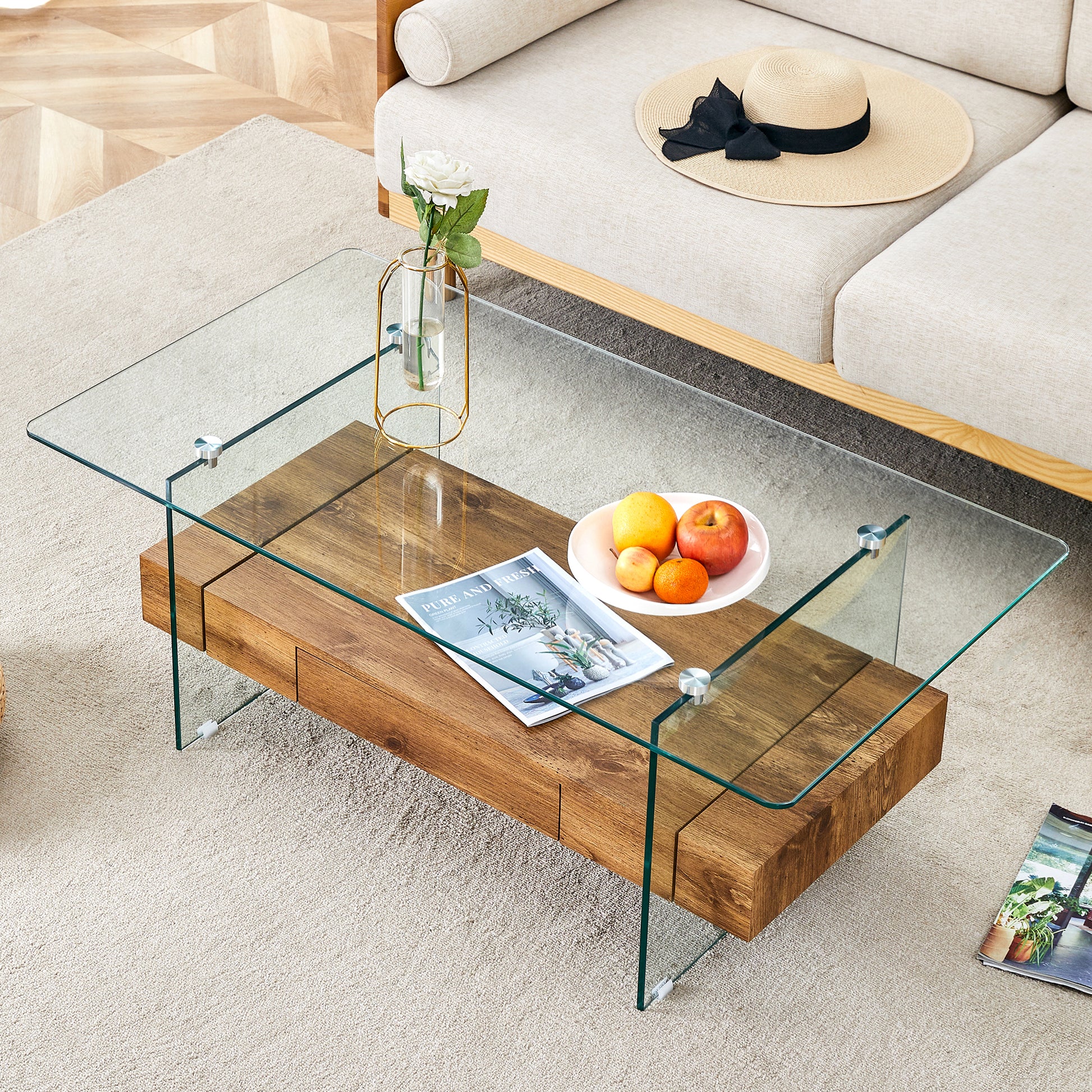 Modern wood and glass coffee table with magazine and fruit