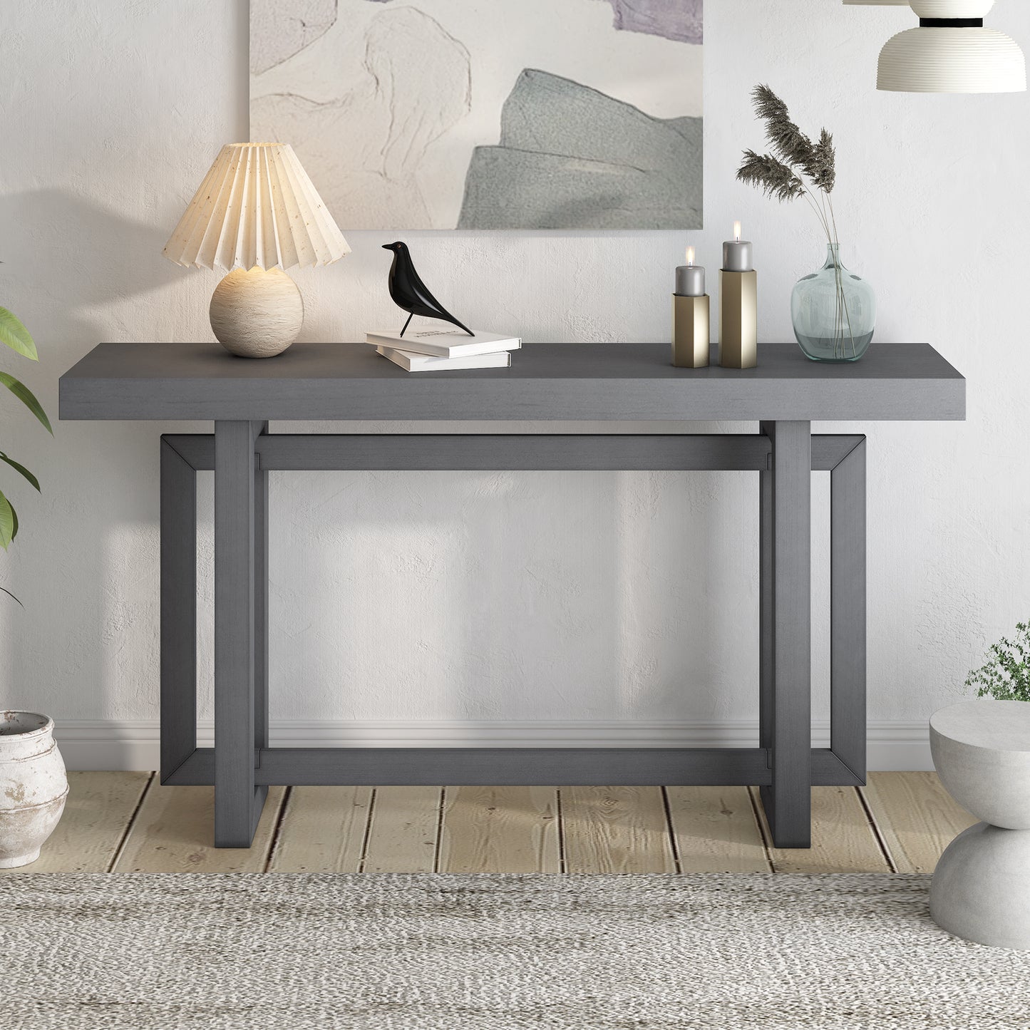 Dark gray modern console table with clean lines and open geometric legs