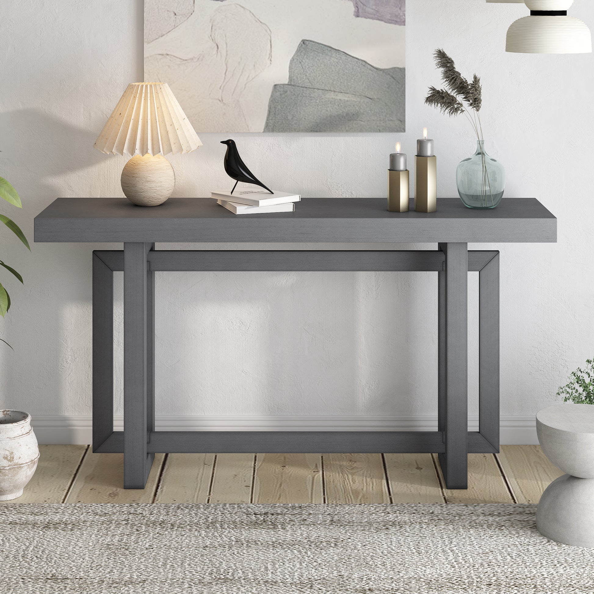 Dark gray modern console table with clean lines and open geometric legs
