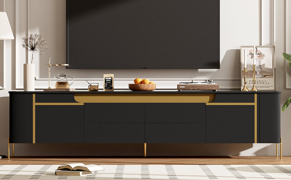 Sleek black media console with gold accents and tapered legs