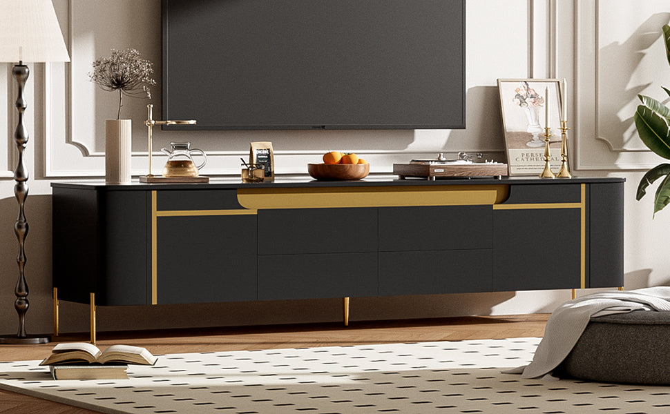 Modern black media console with gold accents and slender legs