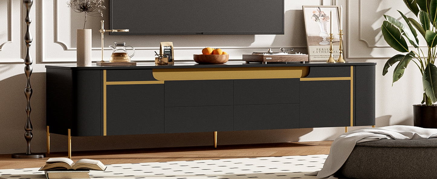 Sleek black media console with gold accents and tapered legs