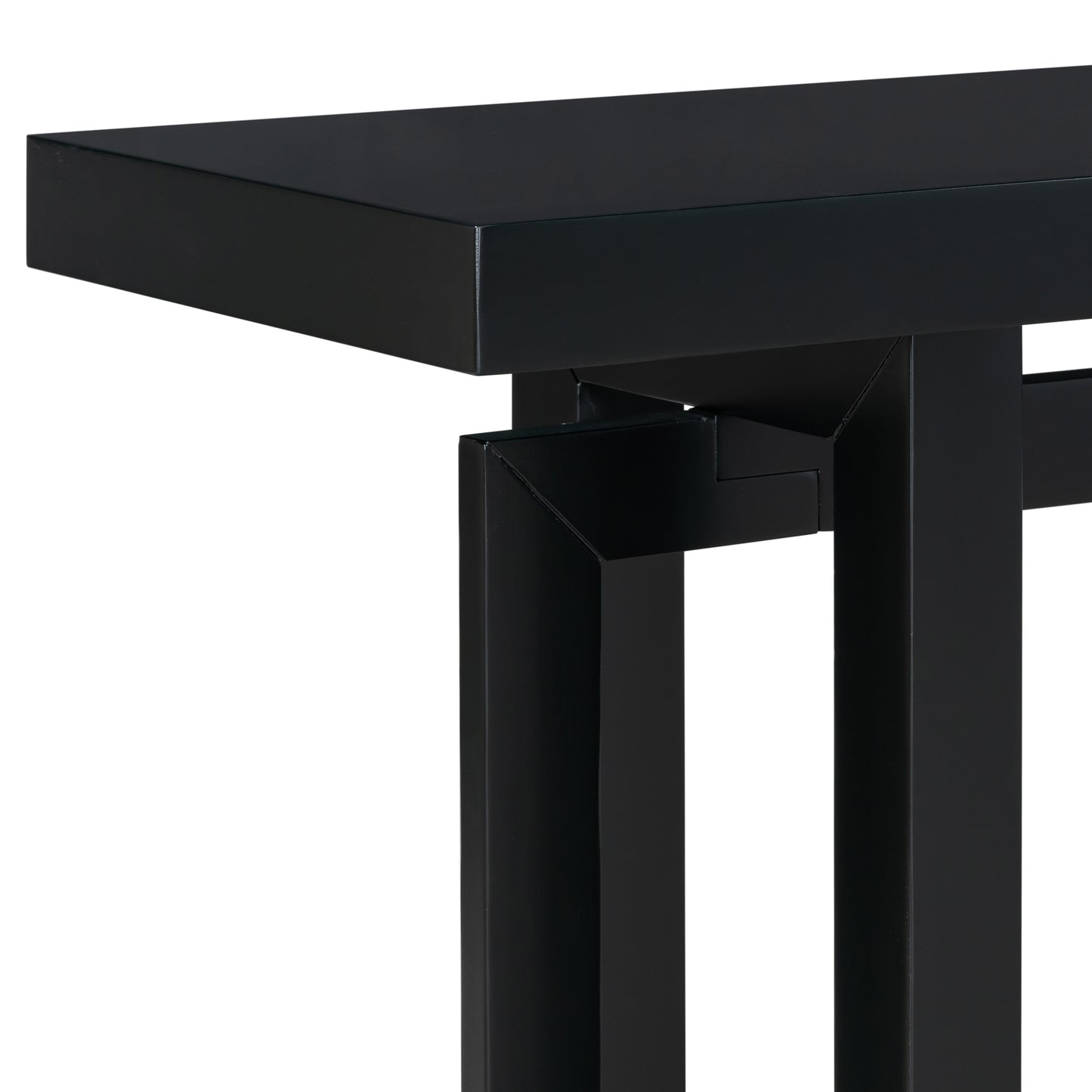 Closeup of a matte black metal console table leg with geometric detail