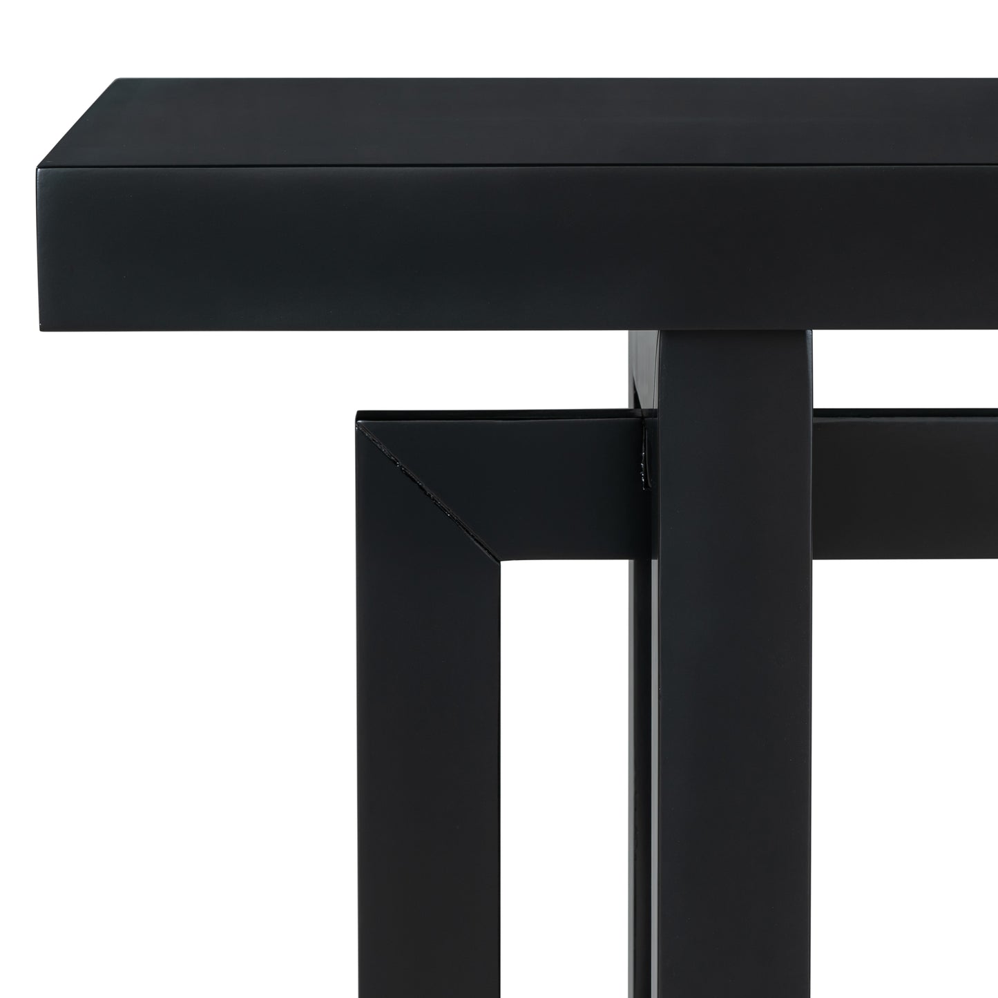 Closeup of a modern black metal coffee table with clean lines and a matte finish