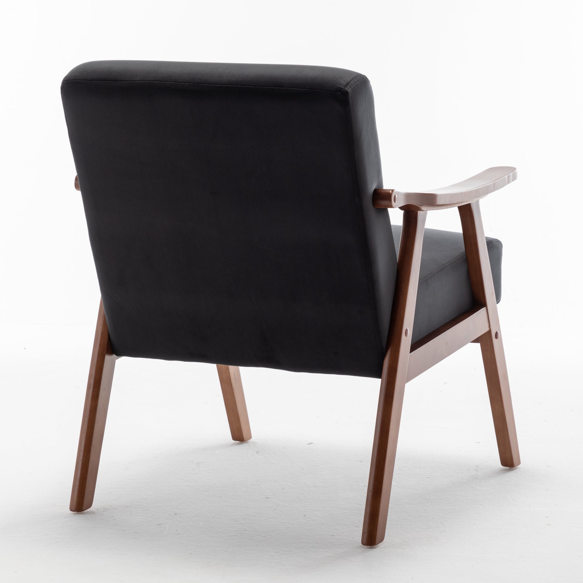 Black fabric accent chair with curved wooden armrests and tapered legs