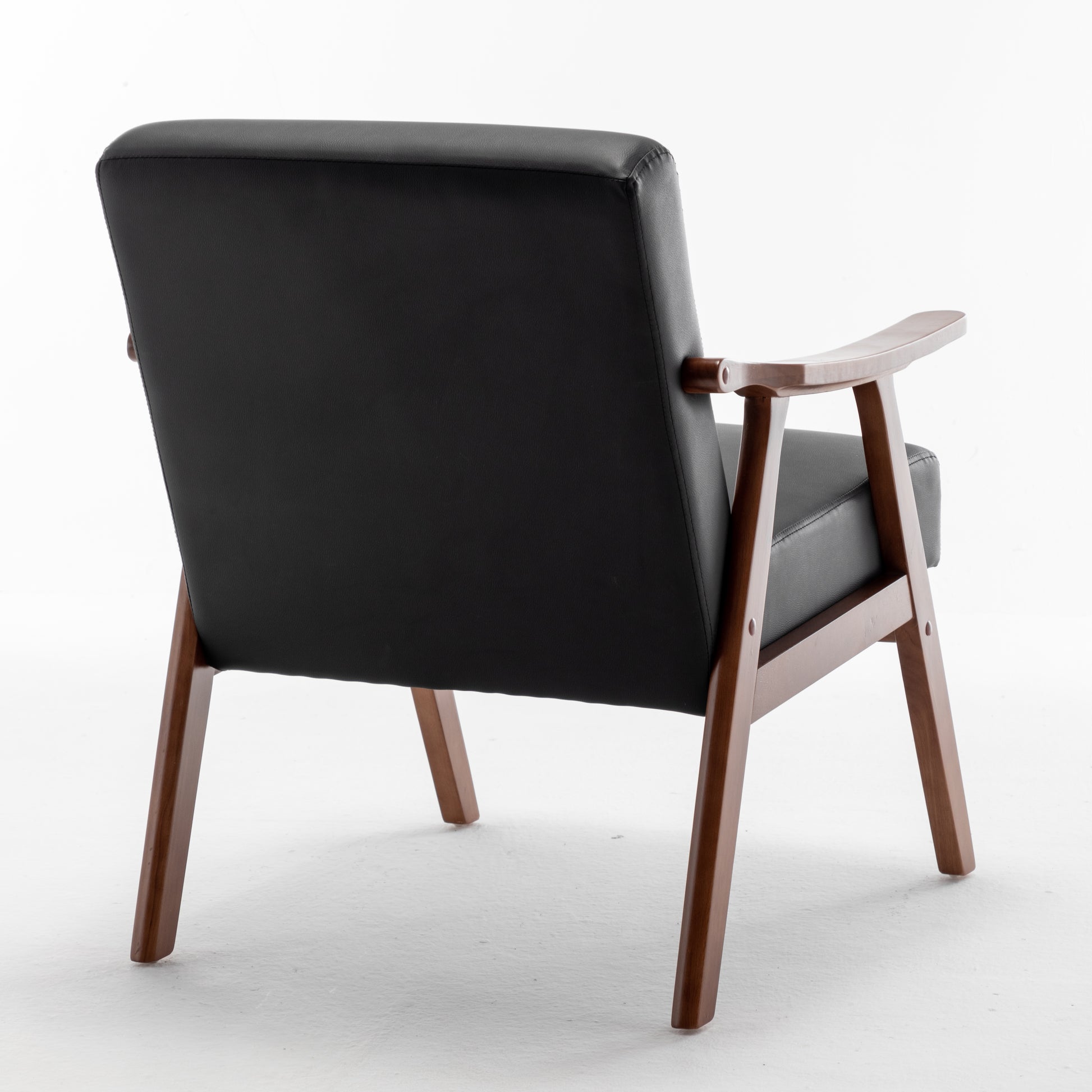Black leather armchair with wooden frame and armrests