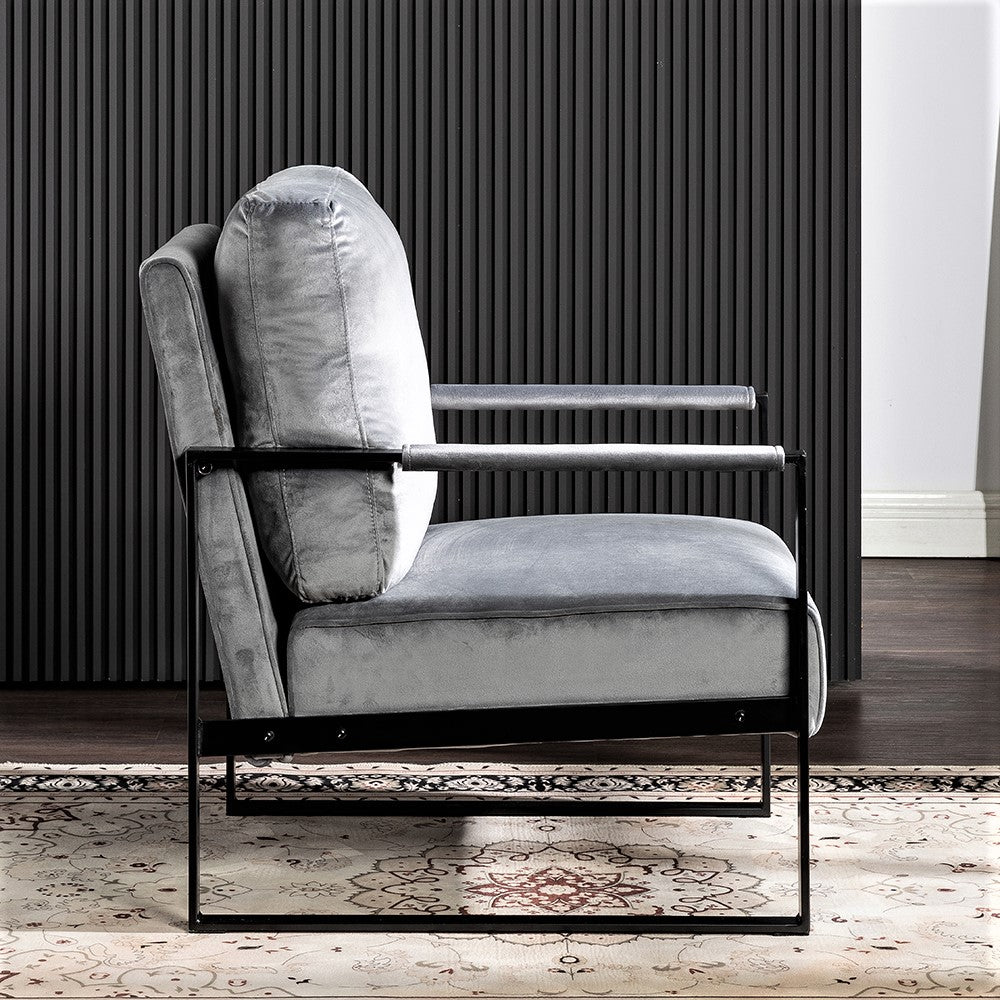 Gray velvet armchair with sleek black metal frame