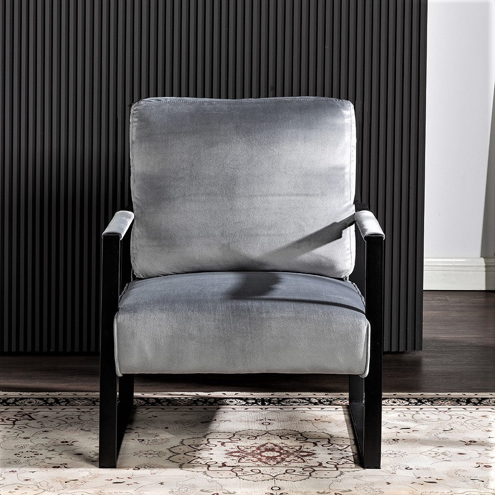 Plush grey velvet armchair with sleek black metal frame